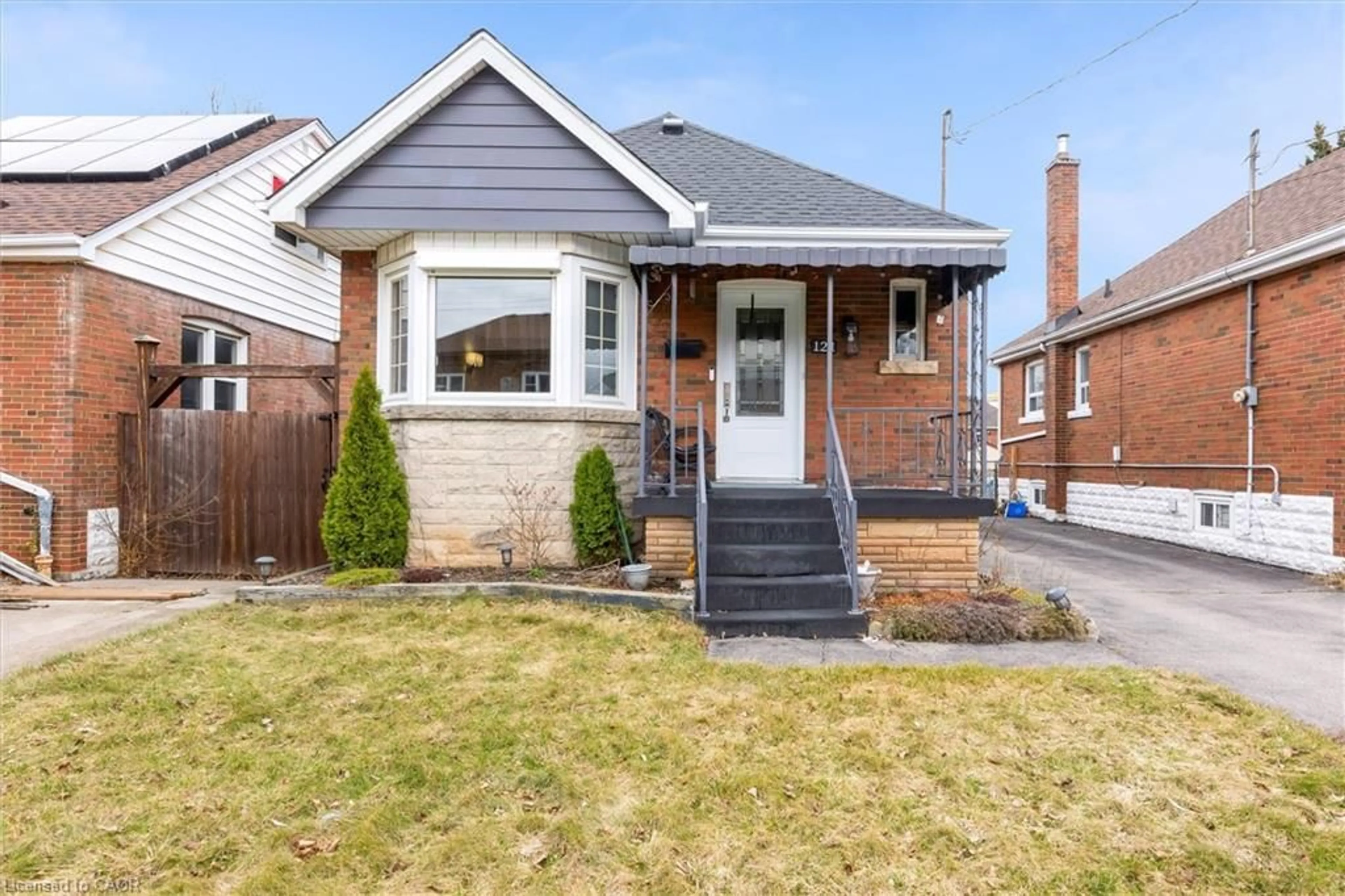 Home with brick exterior material, street for 121 Cameron Ave, Hamilton Ontario L8K 2X6