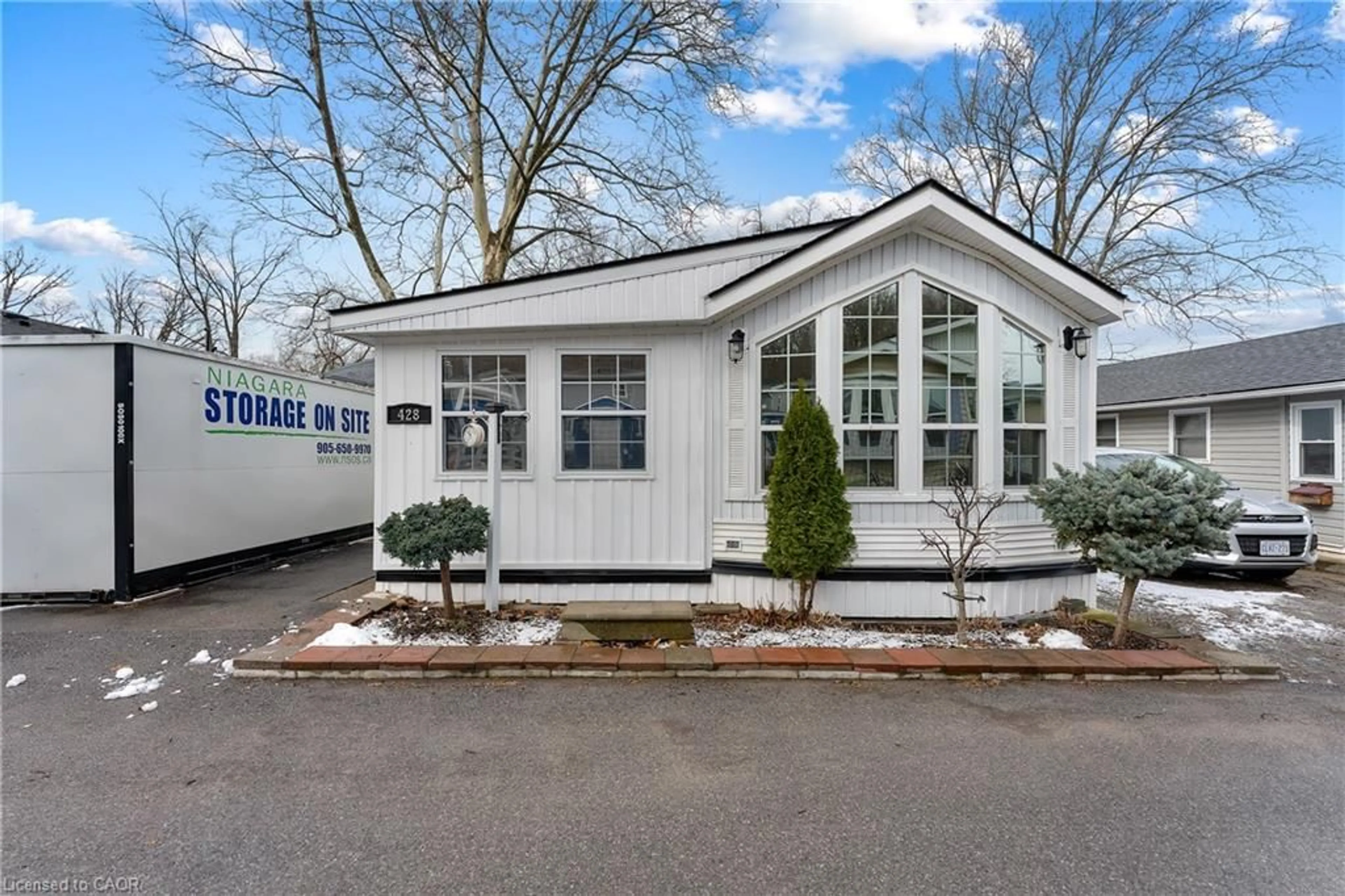 Home with vinyl exterior material, street for 23 Four Mile Creek Rd #428, Niagara-on-the-Lake Ontario L0S 1J1