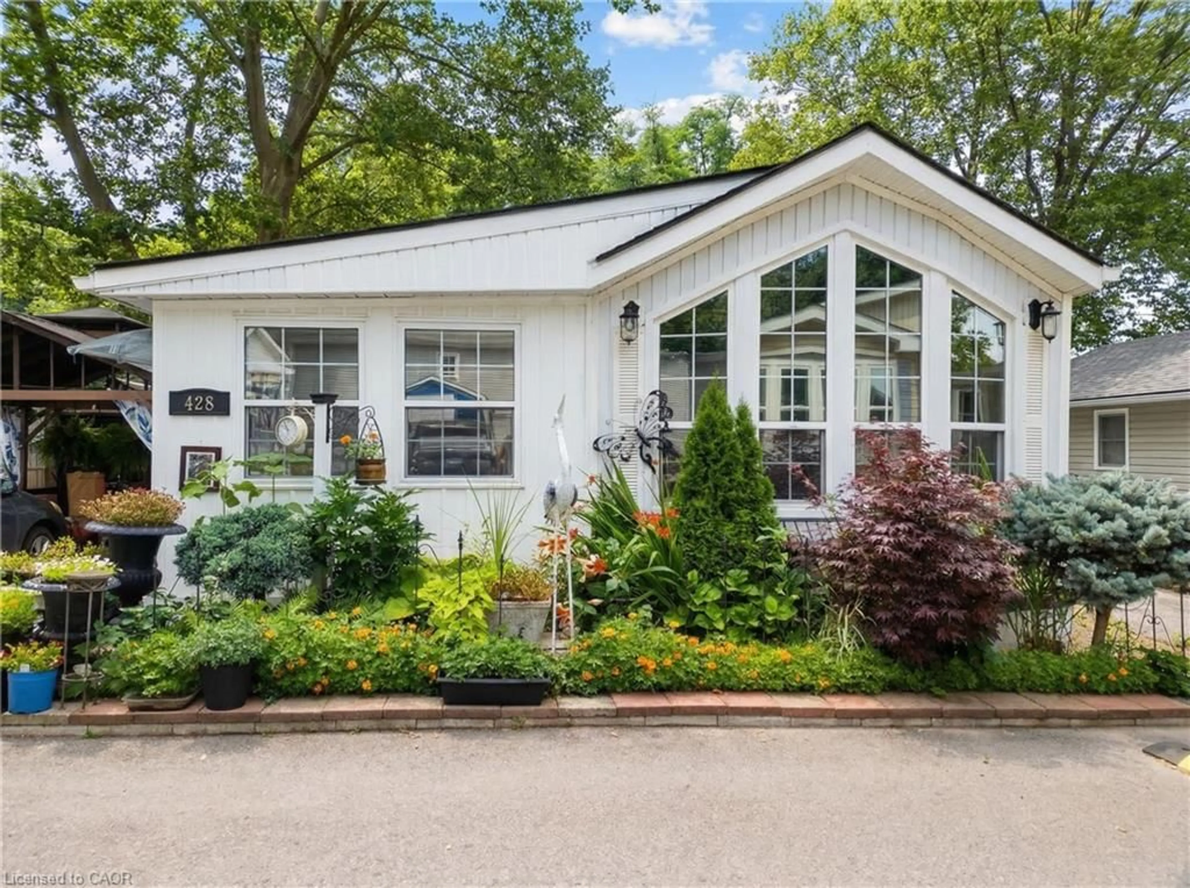 Home with vinyl exterior material, street for 23 Four Mile Creek Rd #428, Niagara-on-the-Lake Ontario L0S 1J1