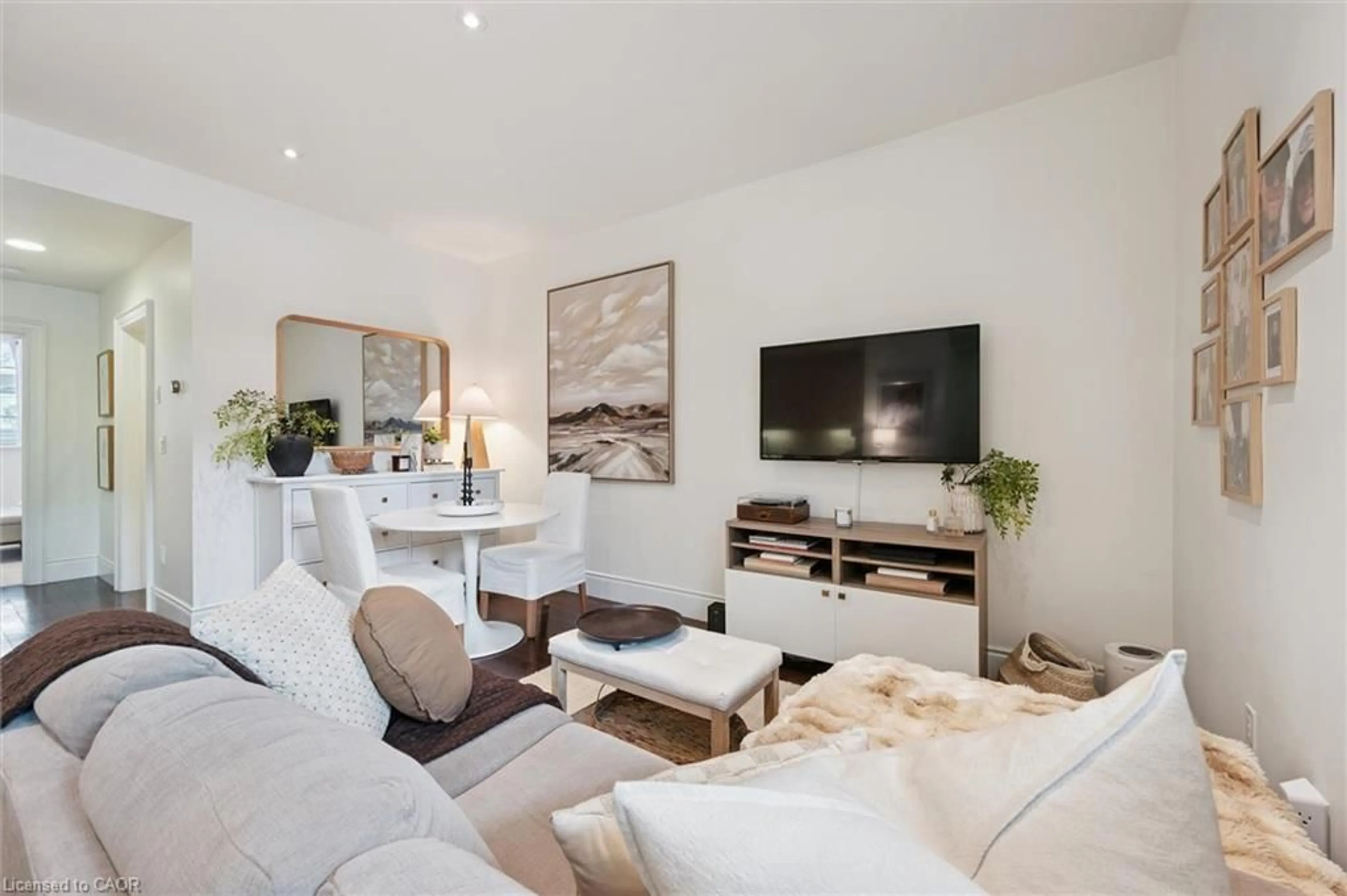 Living room with furniture, wood/laminate floor for 133 Park St #101, Waterloo Ontario N2L 6L7