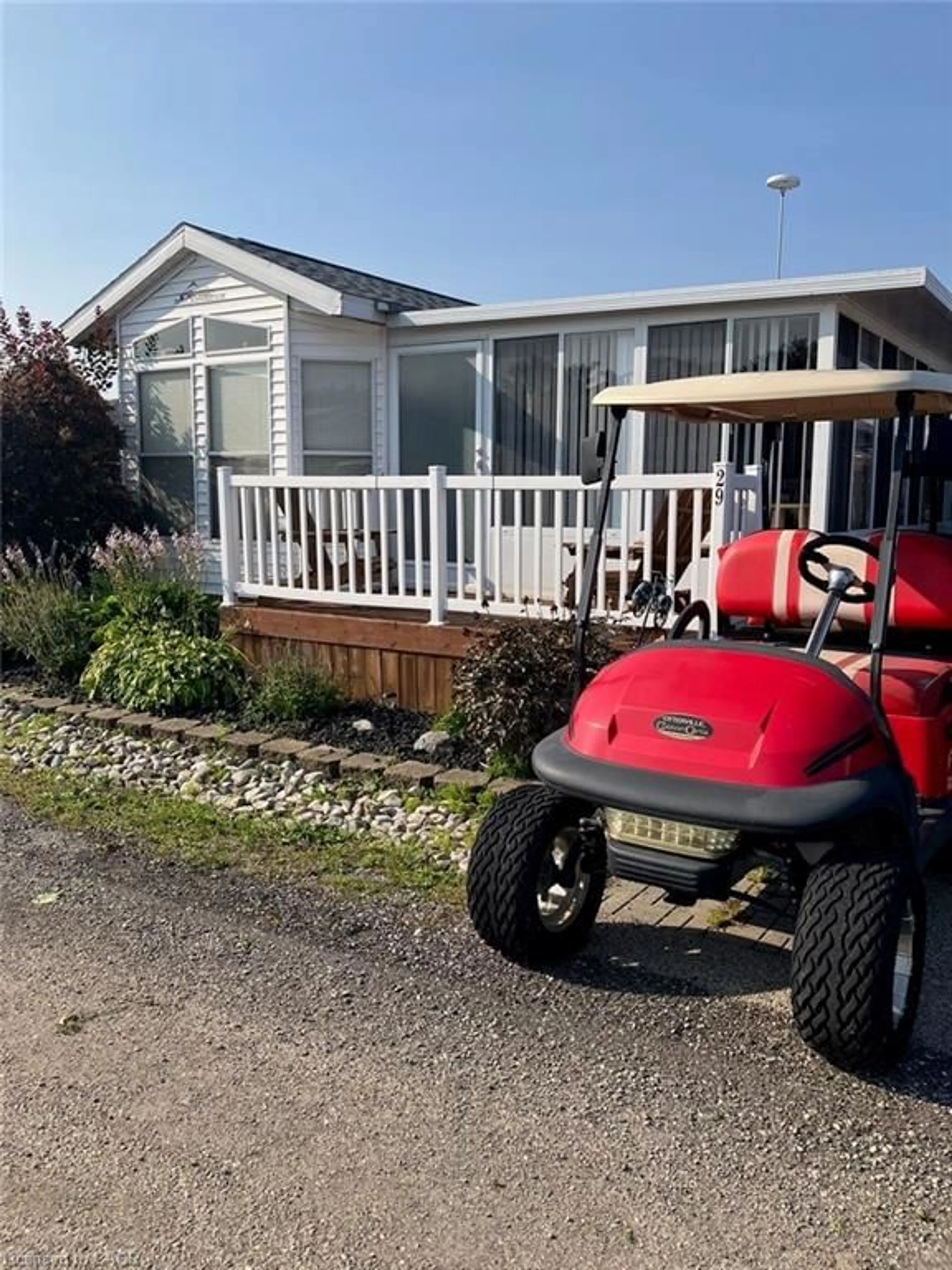 A pic from outside/outdoor area/front of a property/back of a property/a pic from drone, street for 92 Clubhouse Rd #29, Turkey Point Ontario N0E 1T0