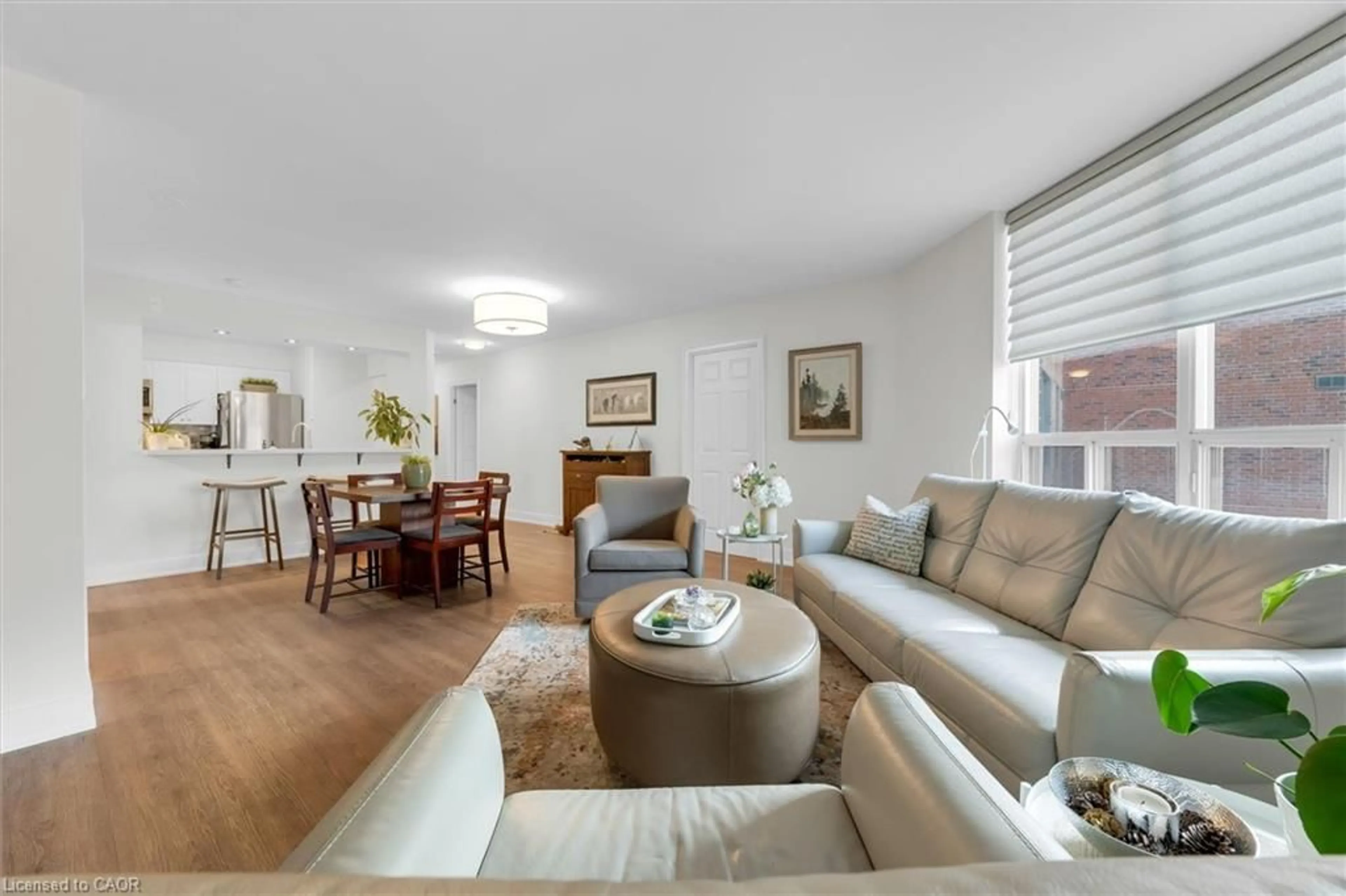 Living room with furniture, wood/laminate floor for 185 Robinson St #203, Oakville Ontario L6J 7P6