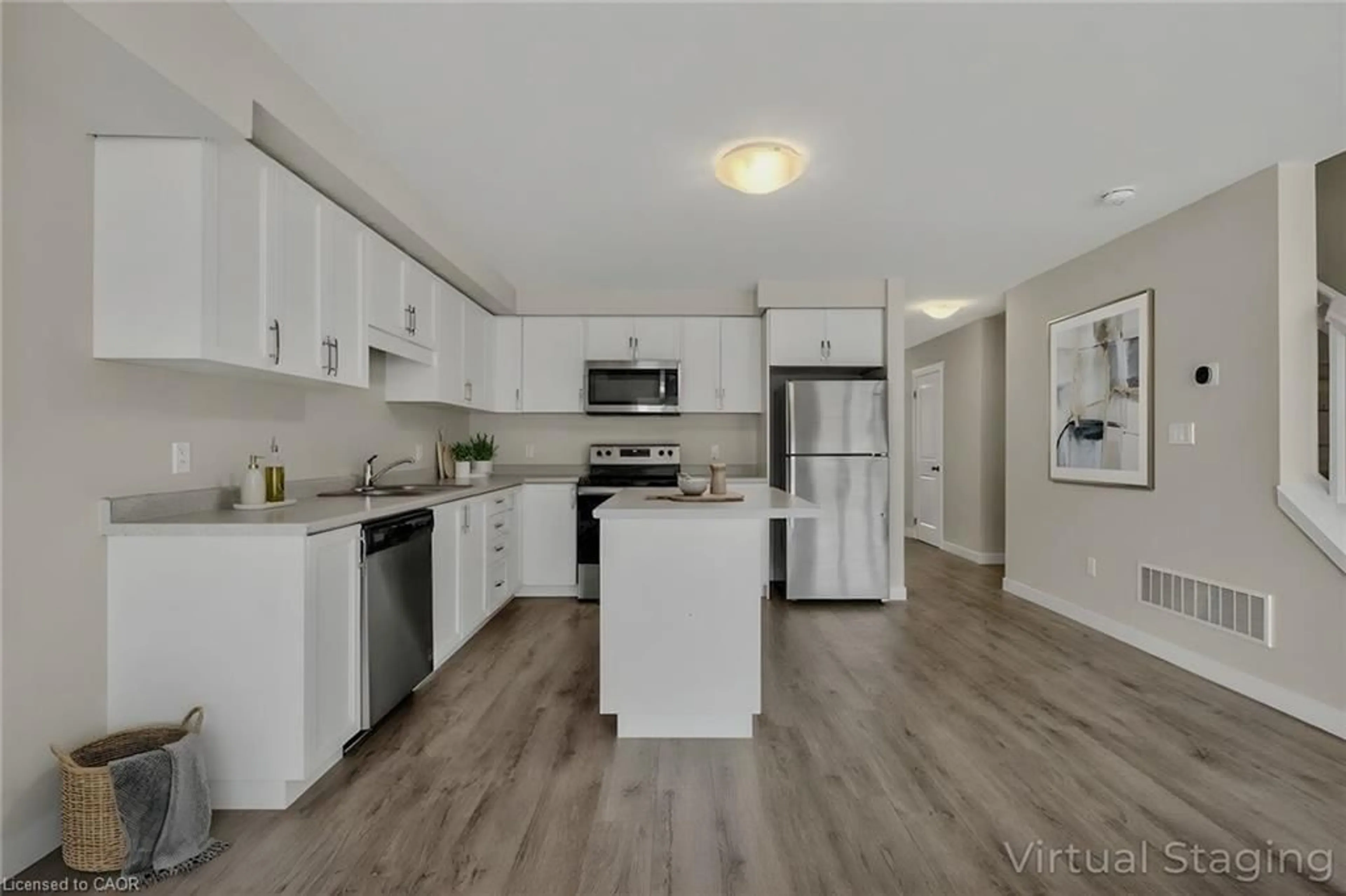Open concept kitchen, wood/laminate floor for 160 Stanley St #8, Simcoe Ontario N3Y 0G6