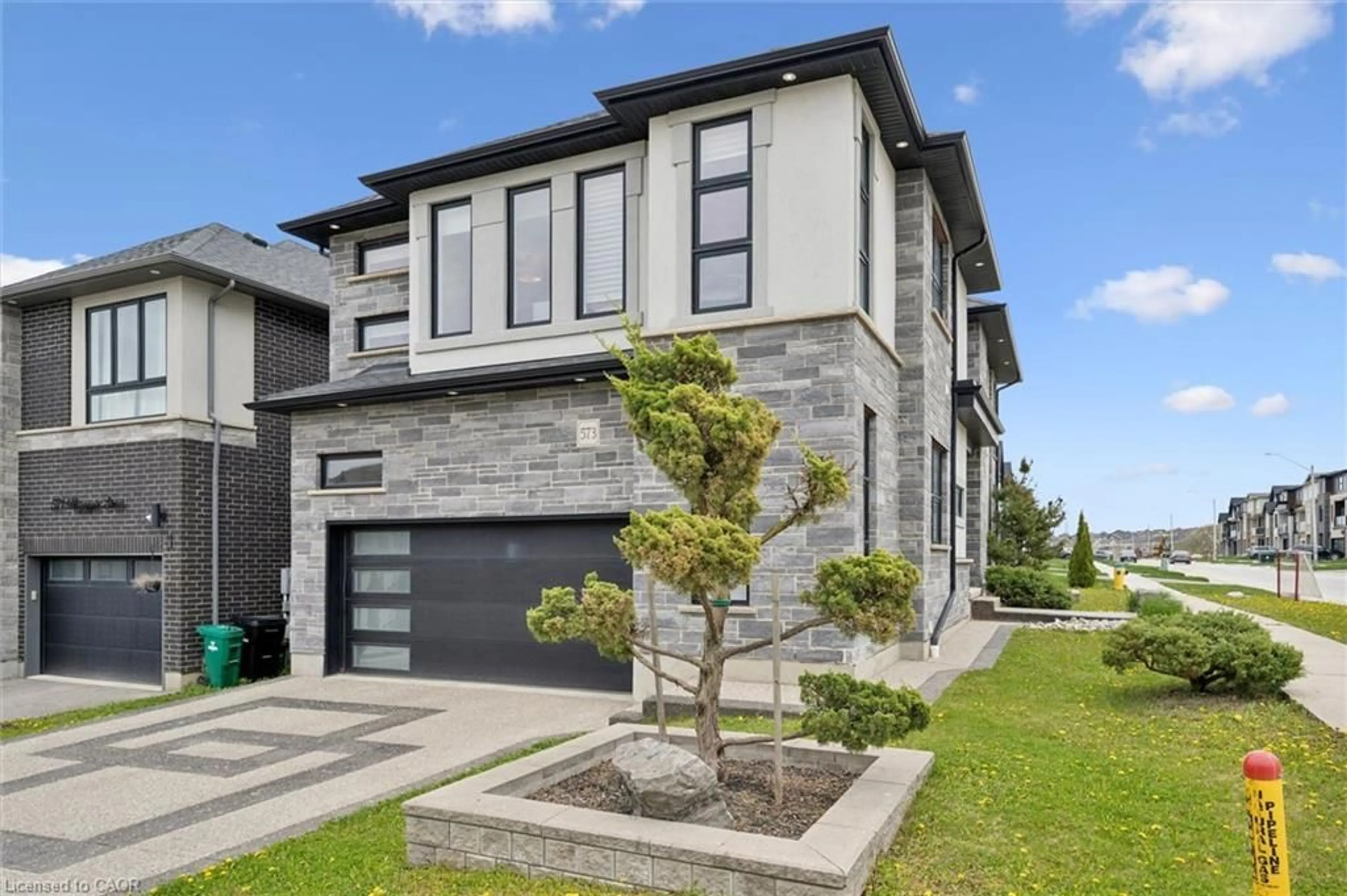 Home with brick exterior material, street for 573 Mayapple St, Waterloo Ontario N2V 0G2