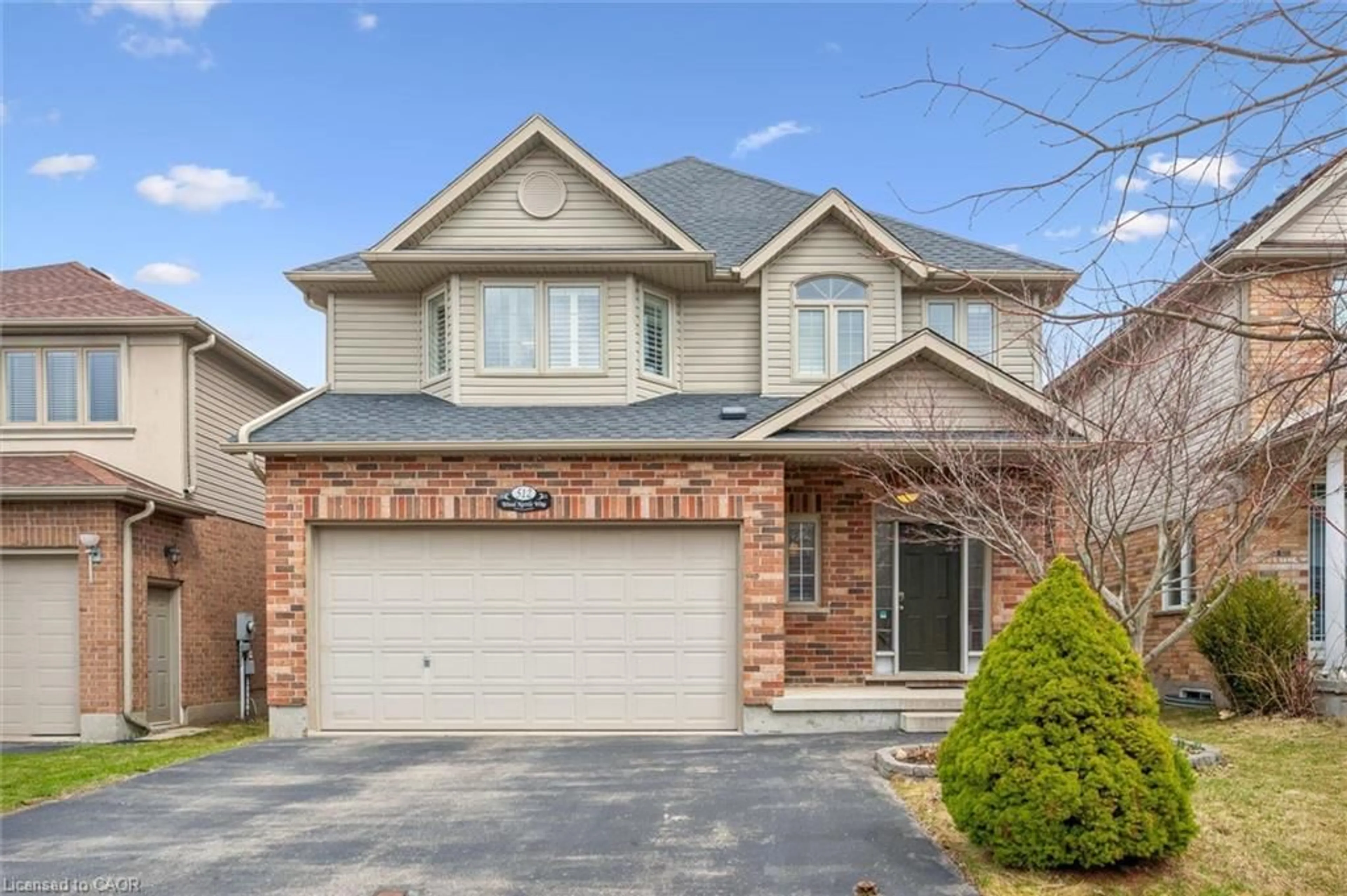 Home with brick exterior material, street for 512 Wood Nettle Way, Waterloo Ontario N2V 2X9