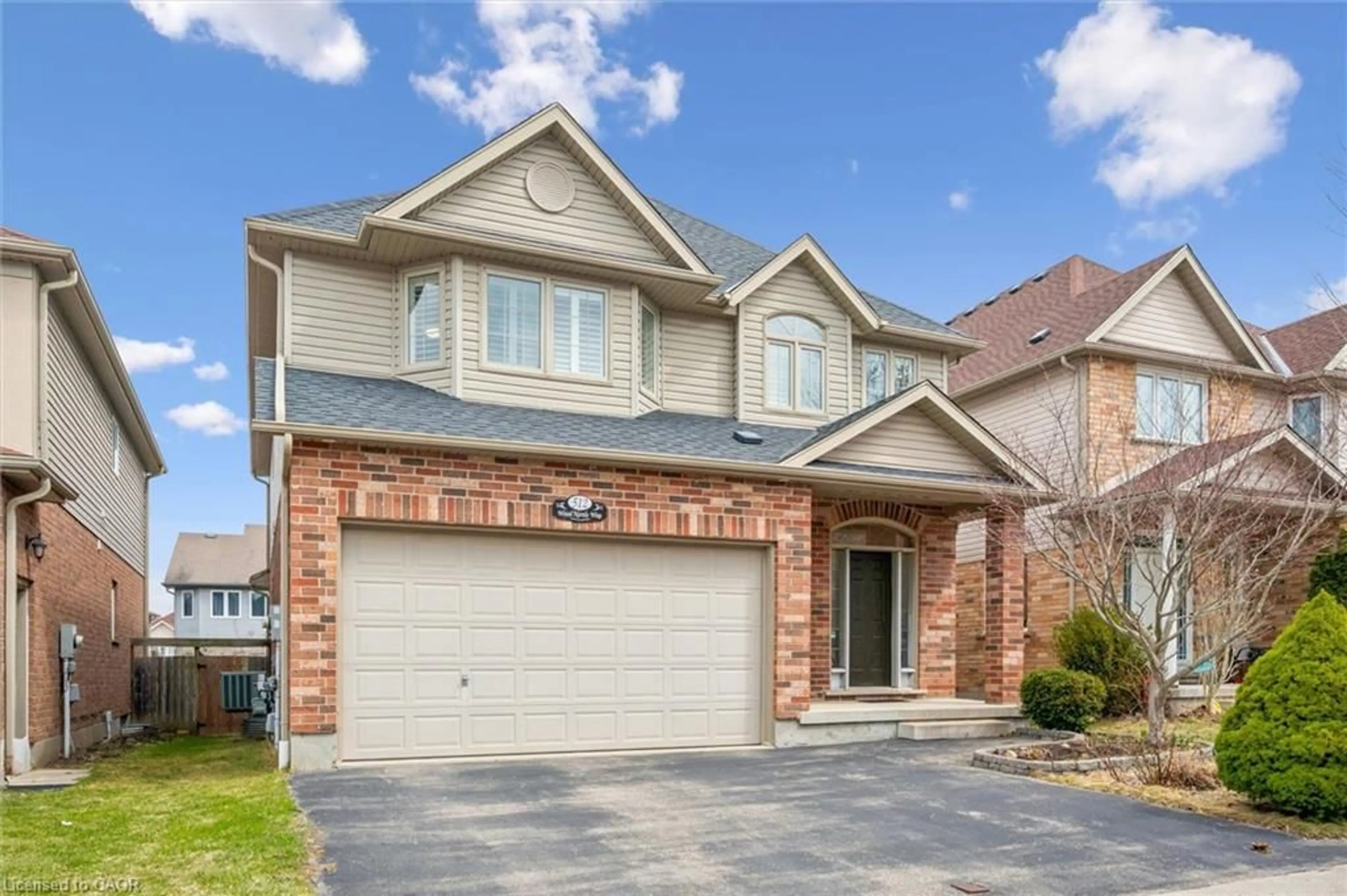 Home with brick exterior material, street for 512 Wood Nettle Way, Waterloo Ontario N2V 2X9