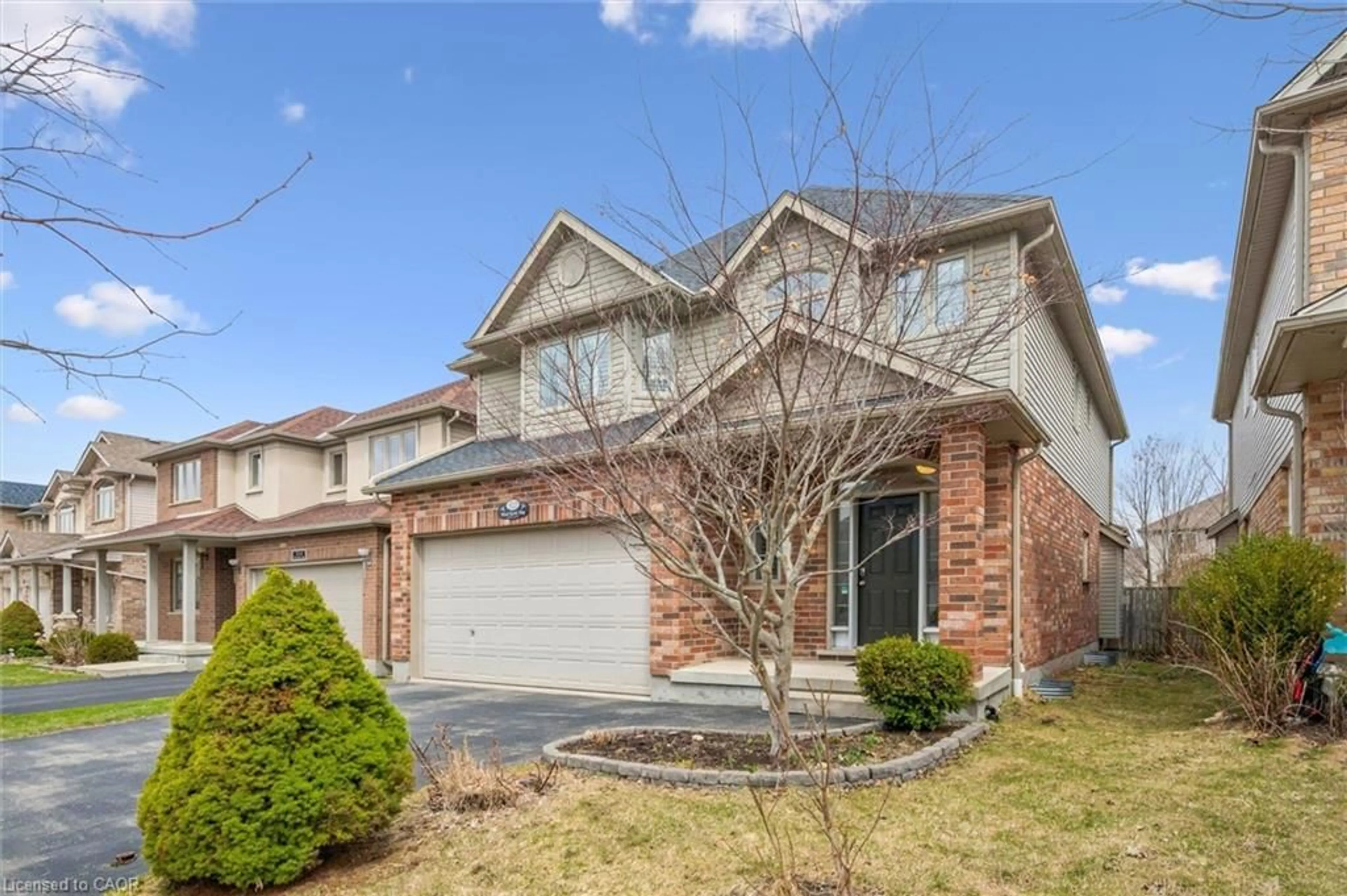 Home with brick exterior material, street for 512 Wood Nettle Way, Waterloo Ontario N2V 2X9