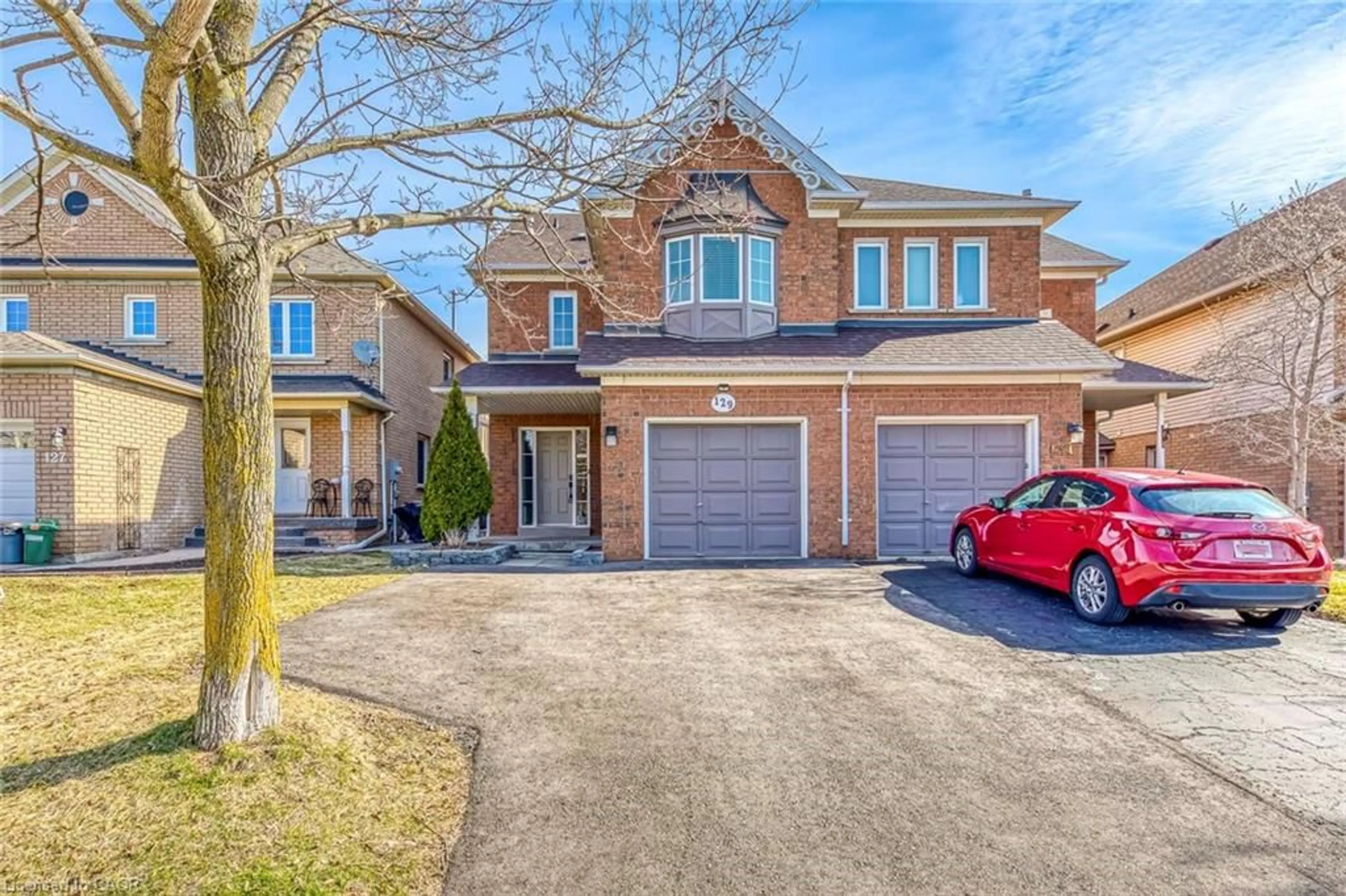Home with brick exterior material, street for 129 Harnesworth Cres, Waterdown Ontario L8B 0J5
