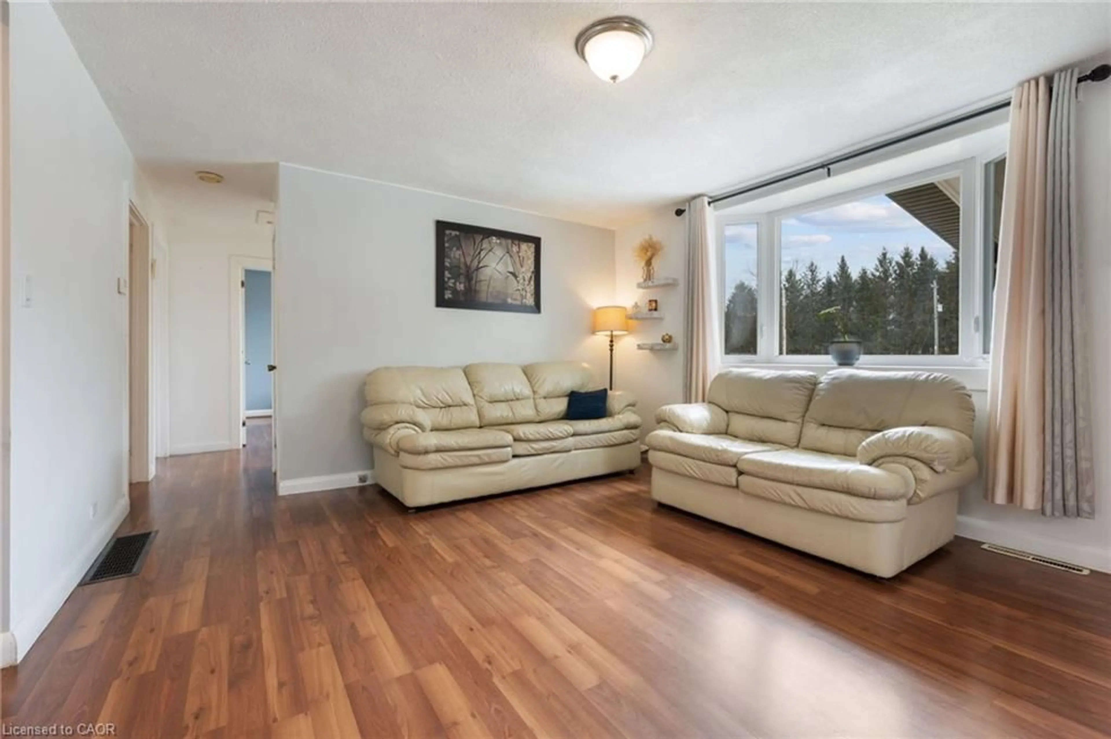 Living room with furniture, wood/laminate floor for 1899 Highway 3, Delhi Ontario N4B 2W6