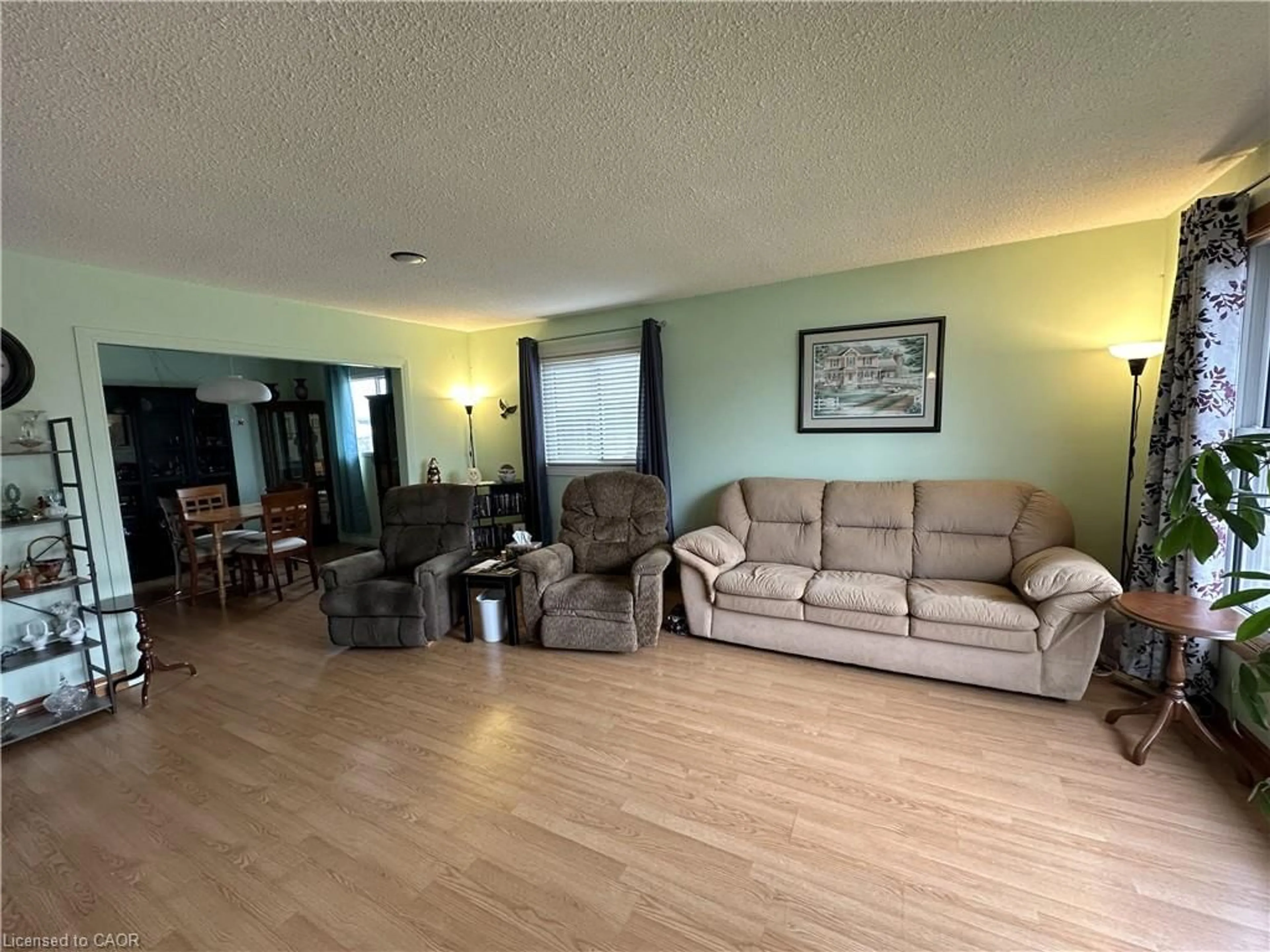 Living room with furniture, wood/laminate floor for 16 Westdale Ave, Port Dover Ontario N0A 1N4