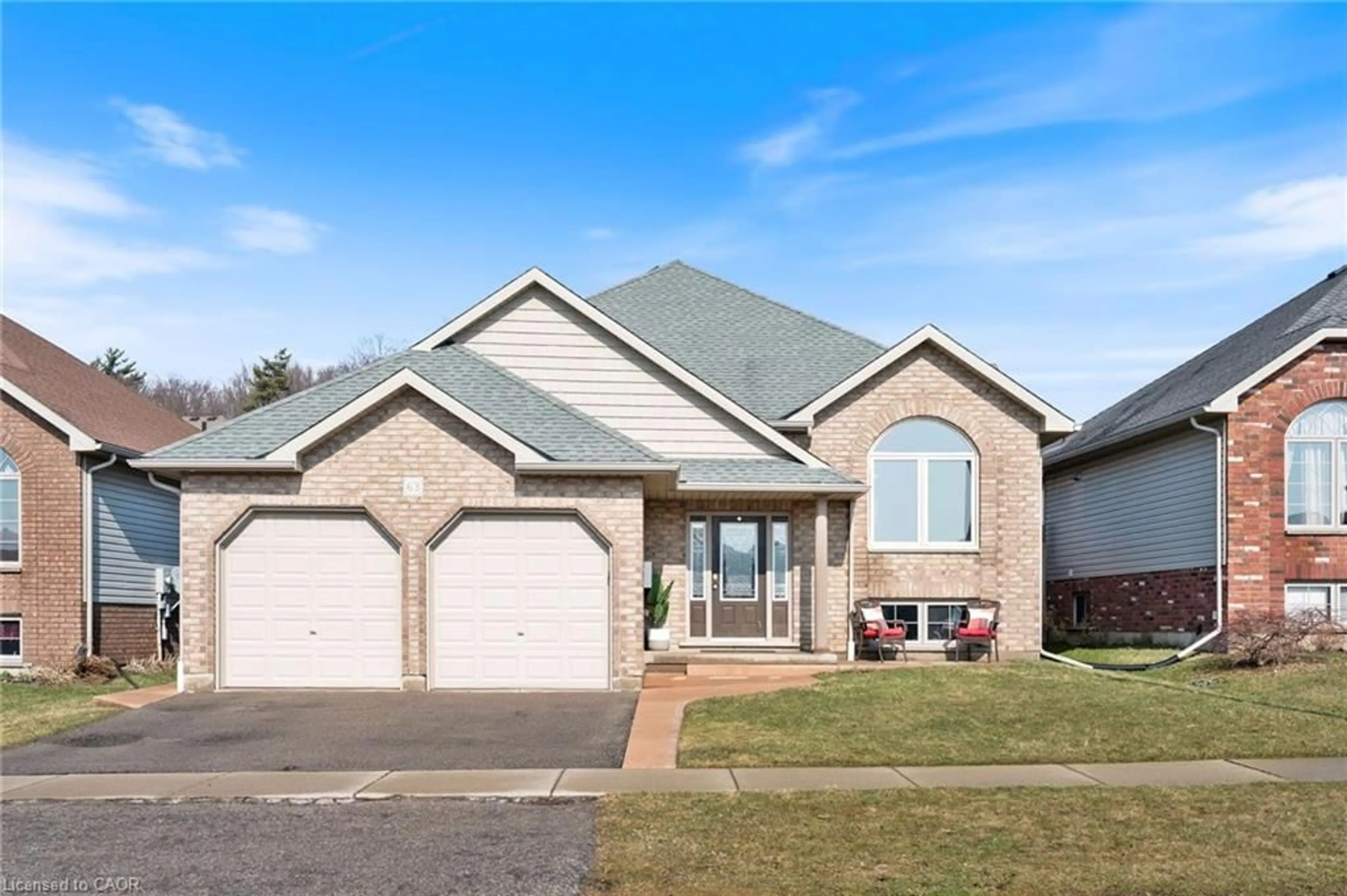 Home with brick exterior material, street for 63 Redbud Cres, Simcoe Ontario N3Y 0B8
