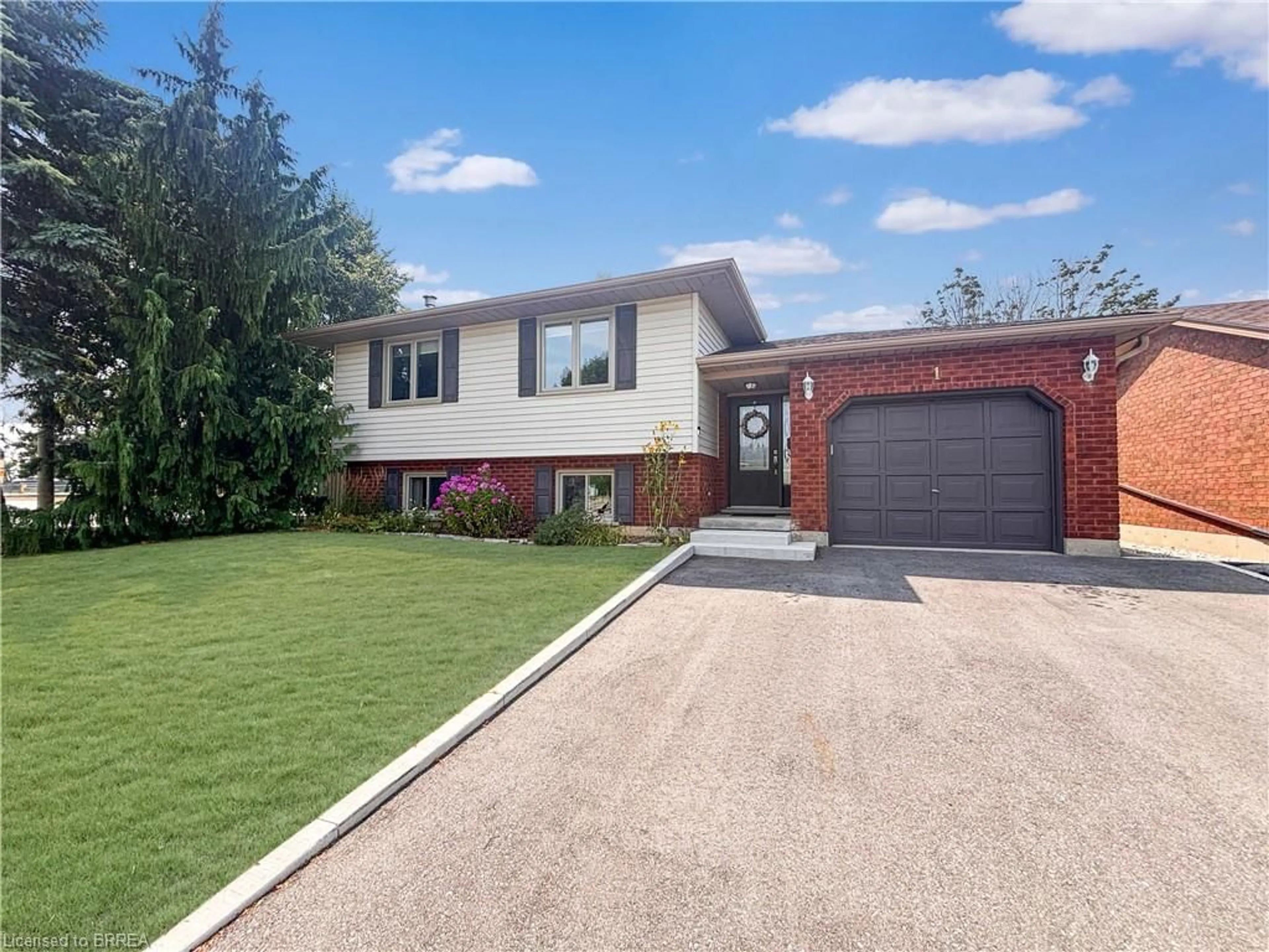 Home with brick exterior material, street for 1 Kiev Blvd, Brantford Ontario N3P 1Y9