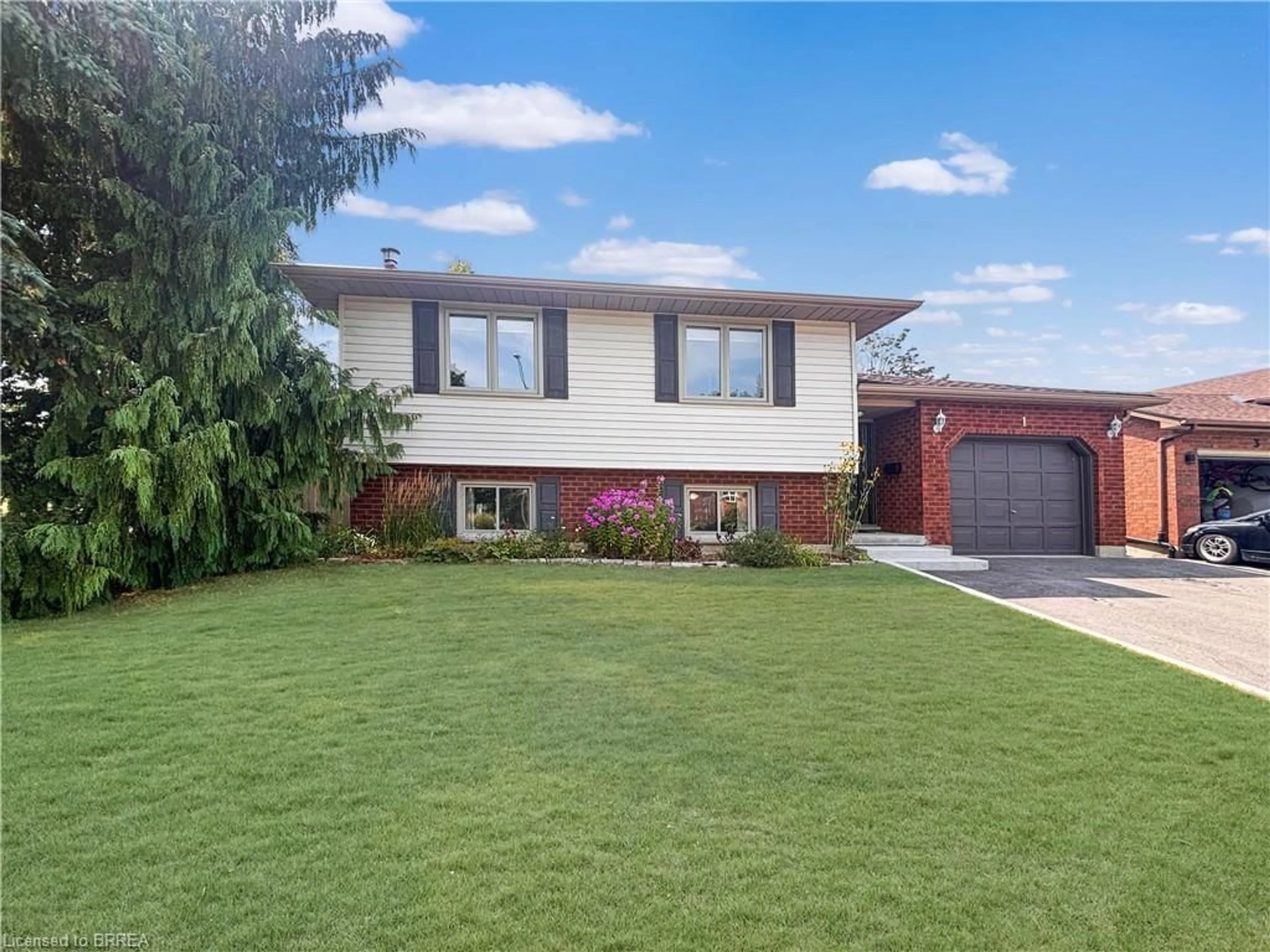 Home with brick exterior material, street for 1 Kiev Blvd, Brantford Ontario N3P 1Y9