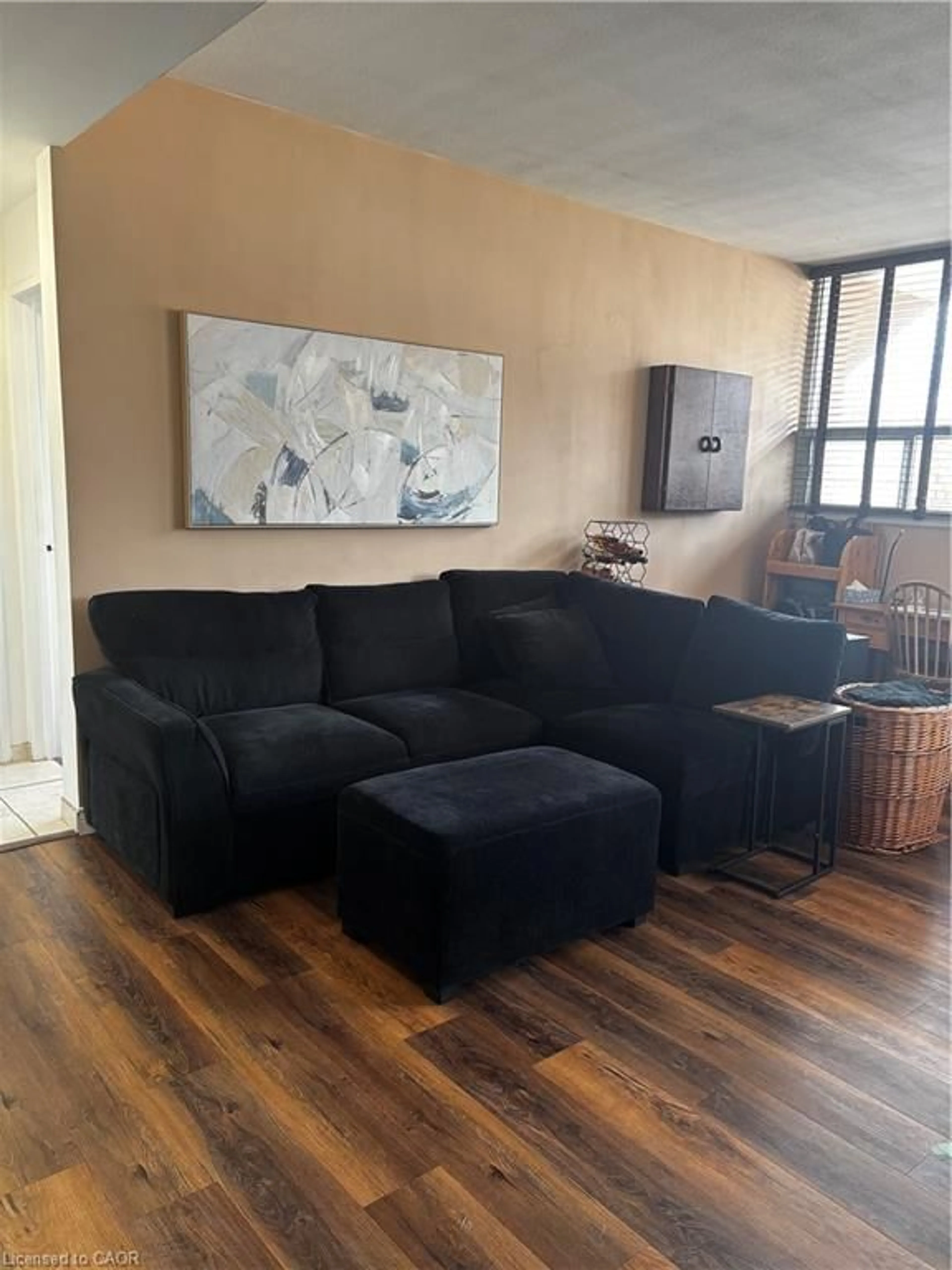 Living room with furniture, wood/laminate floor for 1950 Main St #102, Hamilton Ontario L8S 4M9