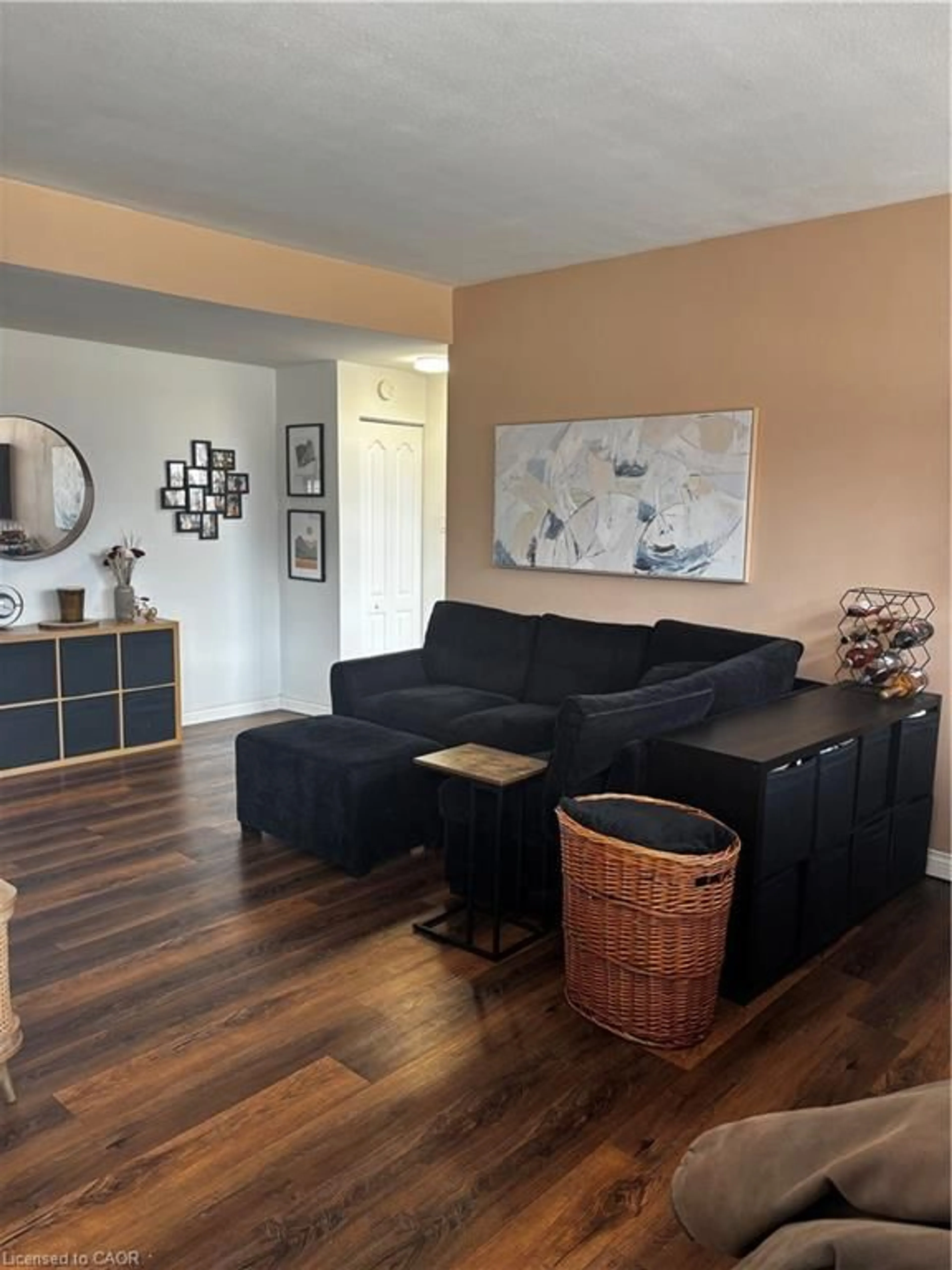 Living room with furniture, wood/laminate floor for 1950 Main St #102, Hamilton Ontario L8S 4M9