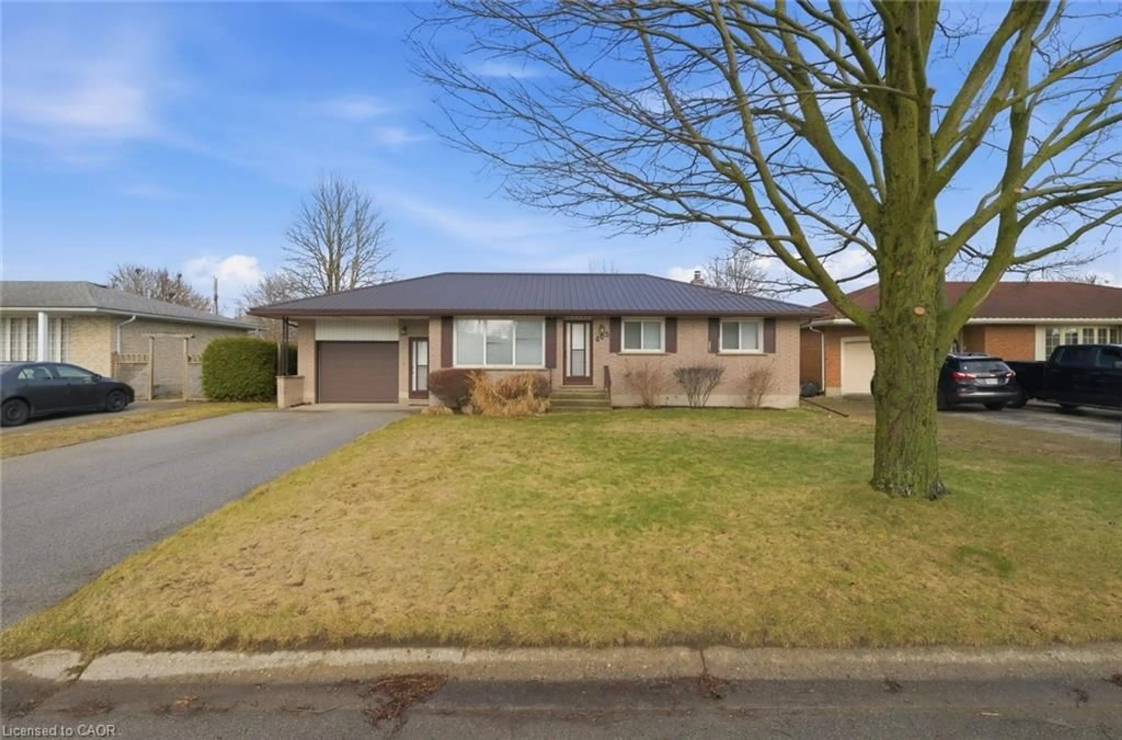 Home with brick exterior material, street for 405 Adams Ave, Delhi Ontario N4B 2Y8