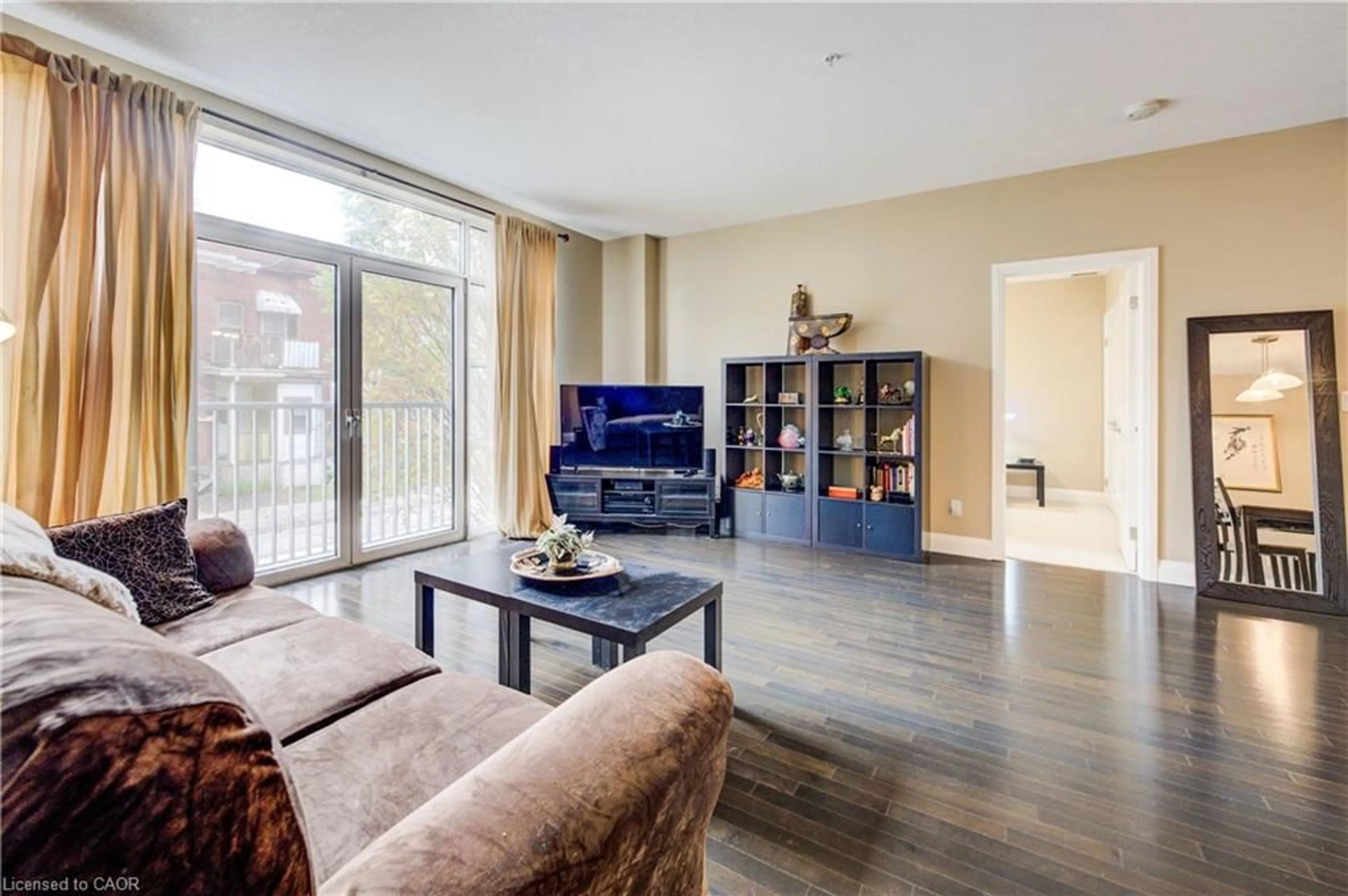 Living room with furniture, wood/laminate floor for 165 Duke St #105, Kitchener Ontario N2H 6T8