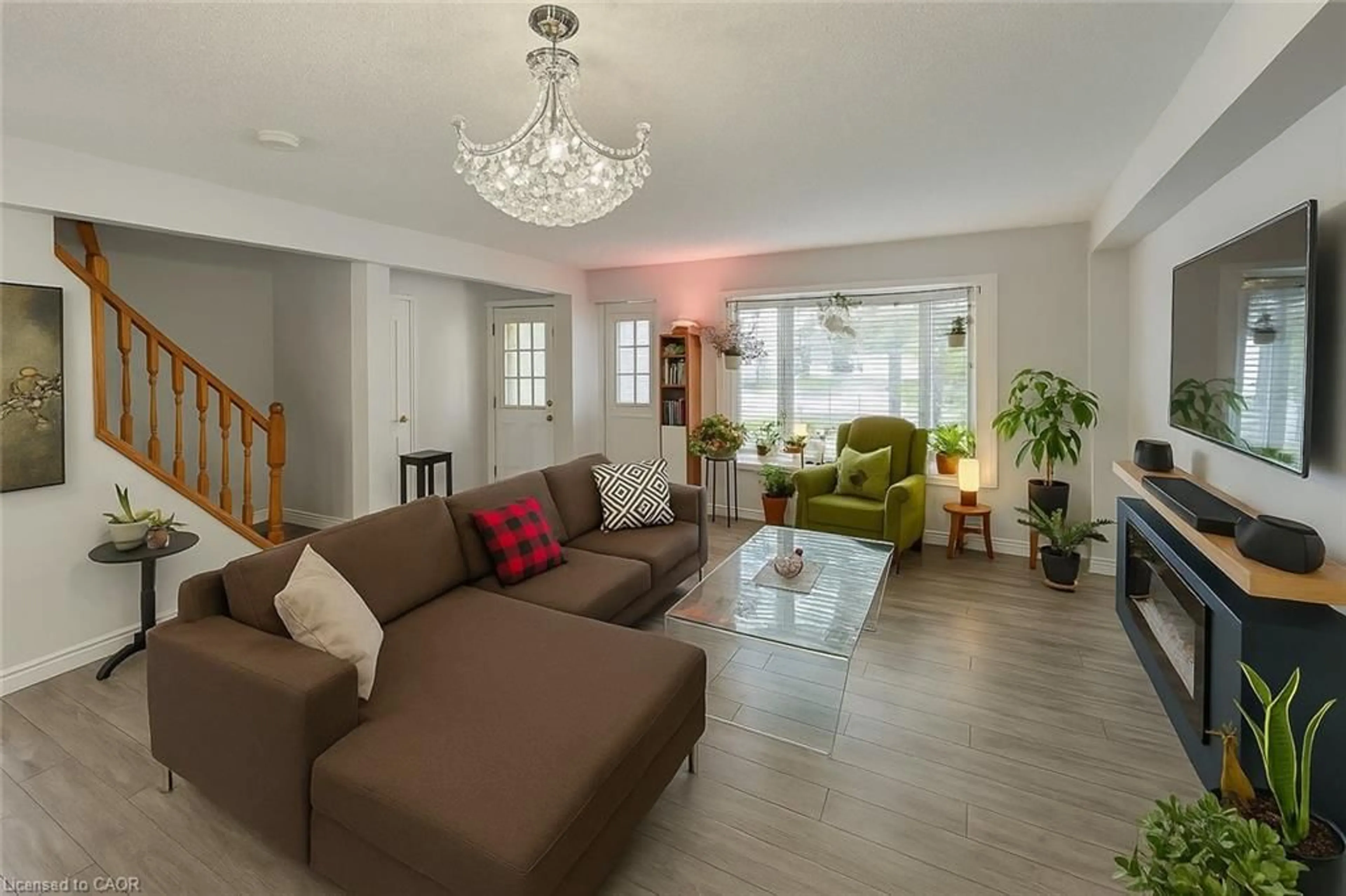 Living room with furniture, wood/laminate floor for 988 Prosperity Crt, London Ontario N5V 5C7