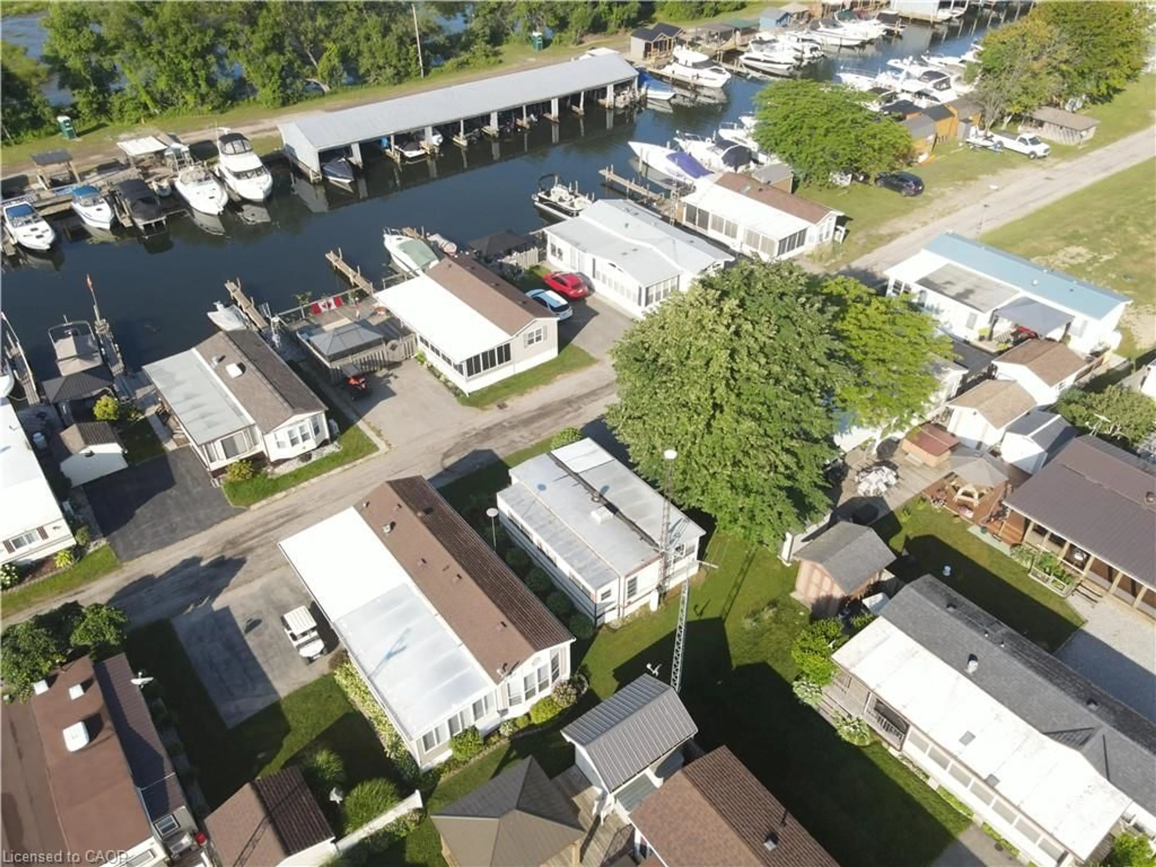 A pic from outside/outdoor area/front of a property/back of a property/a pic from drone, water/lake/river/ocean view for 92 Clubhouse Rd #35, Turkey Point Ontario N0E 1T0