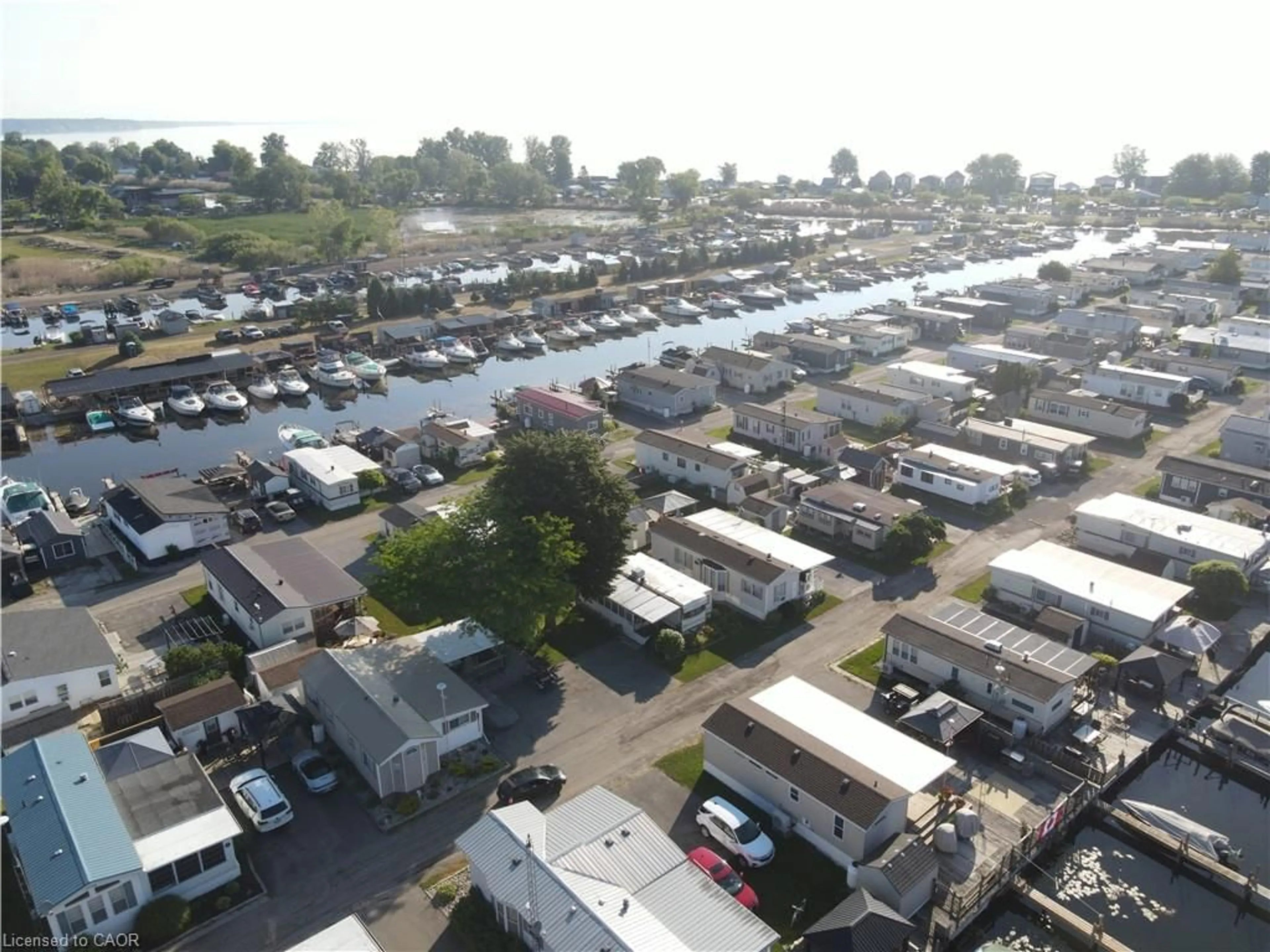 A pic from outside/outdoor area/front of a property/back of a property/a pic from drone, street for 92 Clubhouse Rd #35, Turkey Point Ontario N0E 1T0