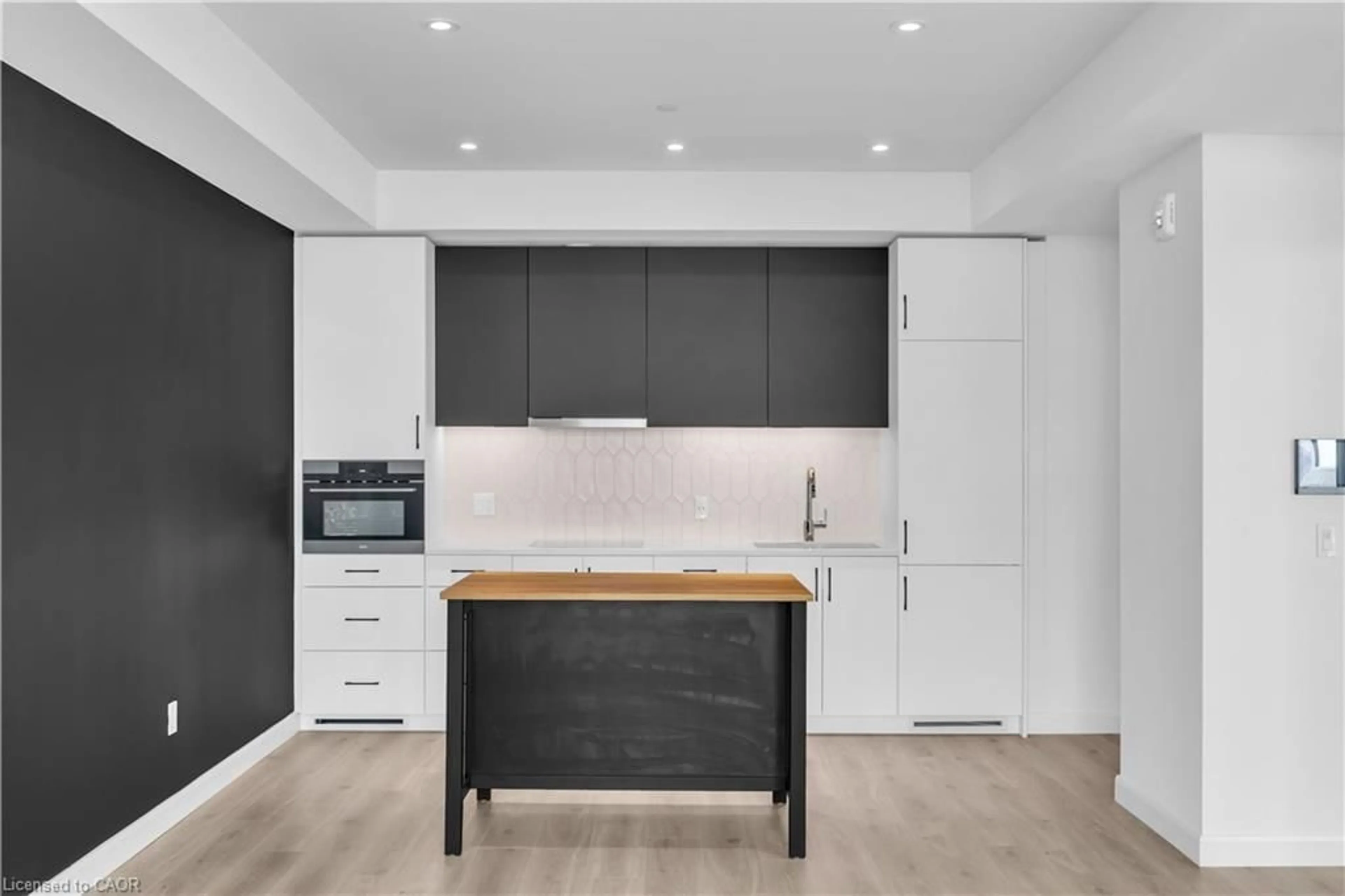Open concept kitchen, wood/laminate floor for 741 King St #1708, Kitchener Ontario N2G 0E9