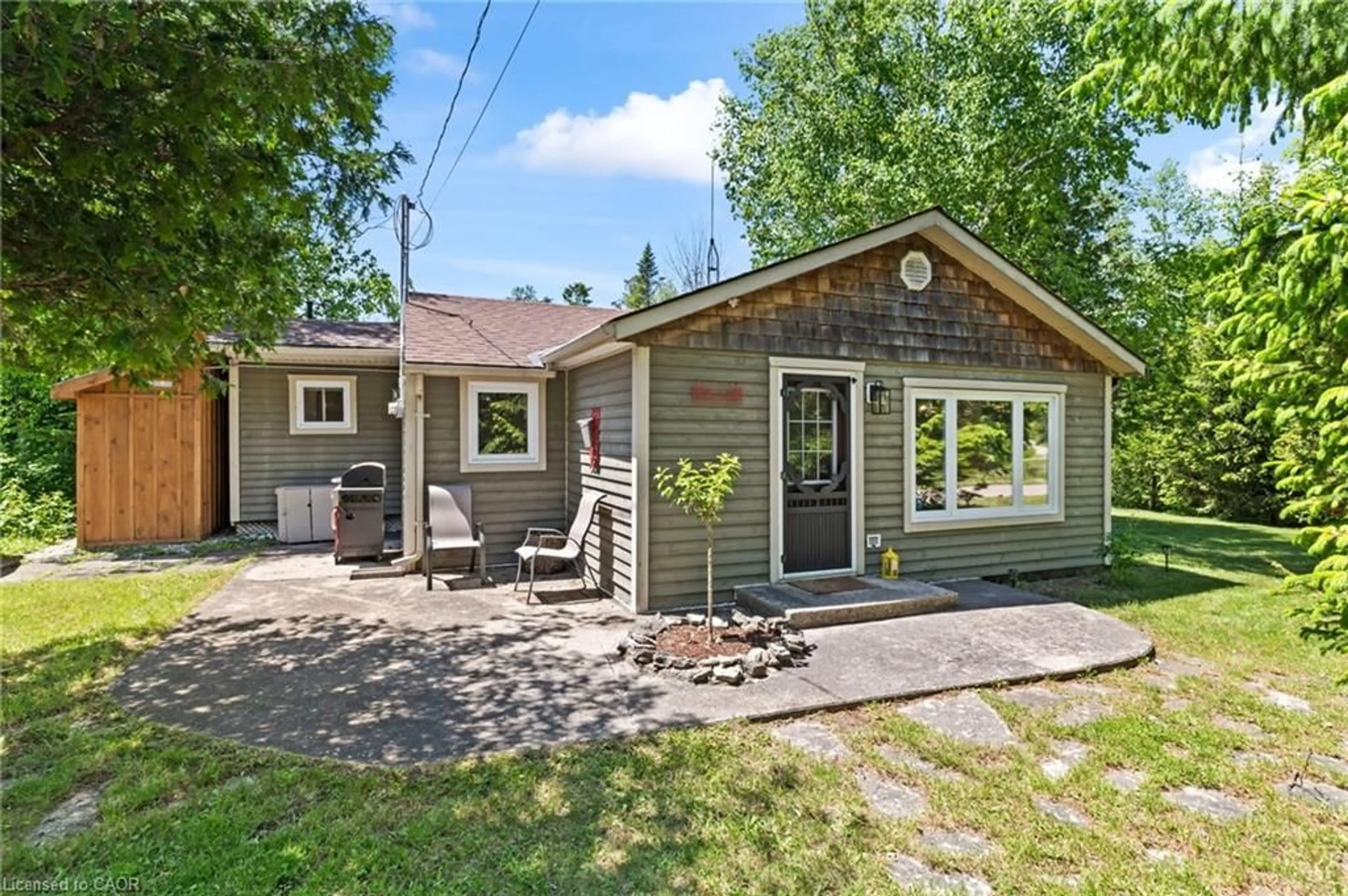 Home with vinyl exterior material, street for 282 Widgeon Cove Rd, Northern Bruce Peninsula Ontario N0H 2T0