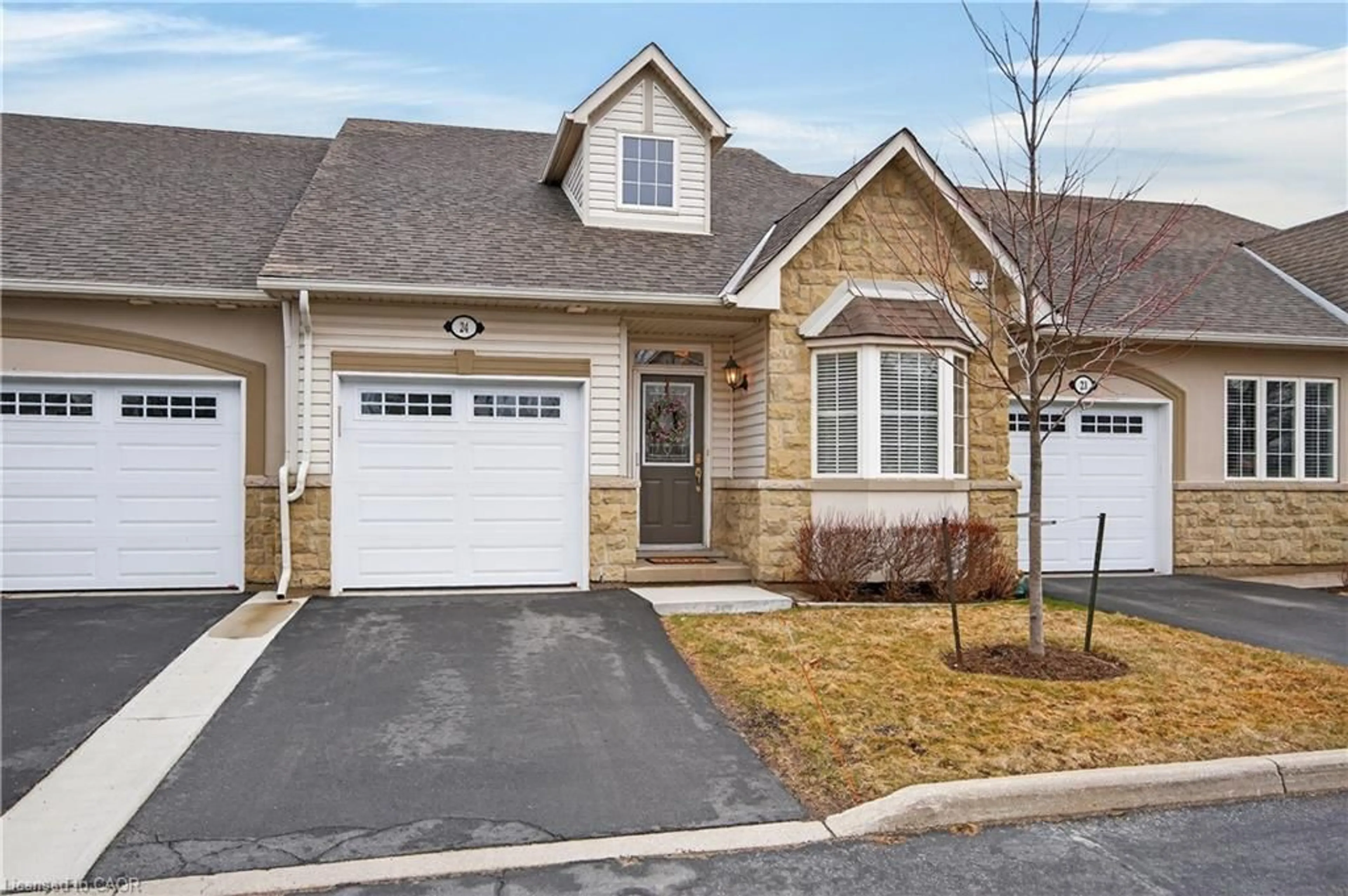 Home with vinyl exterior material, street for 212 Stonehenge Dr #24, Ancaster Ontario L9K 1N5