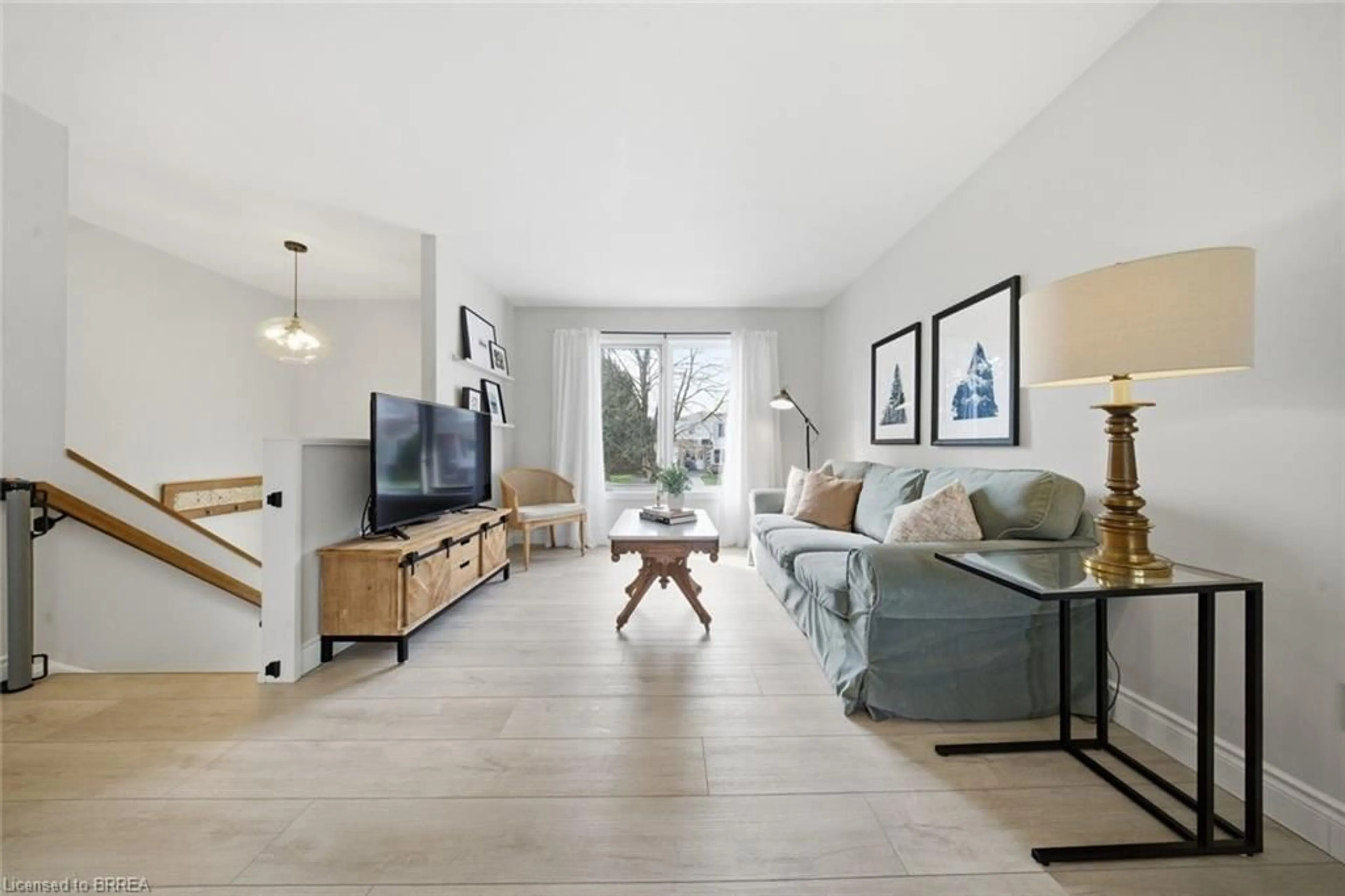 Living room with furniture, ceramic/tile floor for 27 Jasper St, Brantford Ontario N3P 1M9