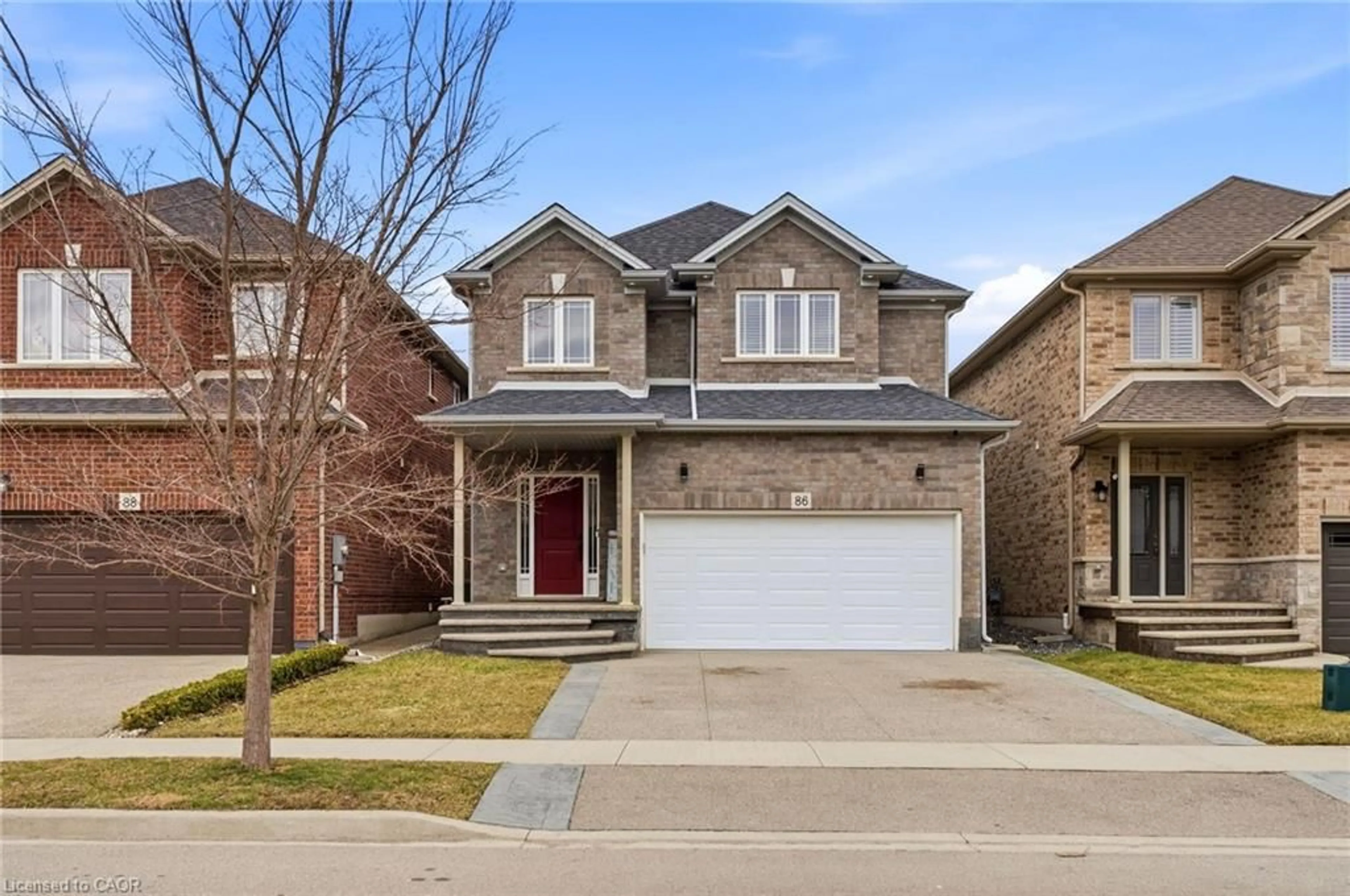 Home with brick exterior material, street for 86 Fairgrounds Dr, Binbrook Ontario L0R 1C0