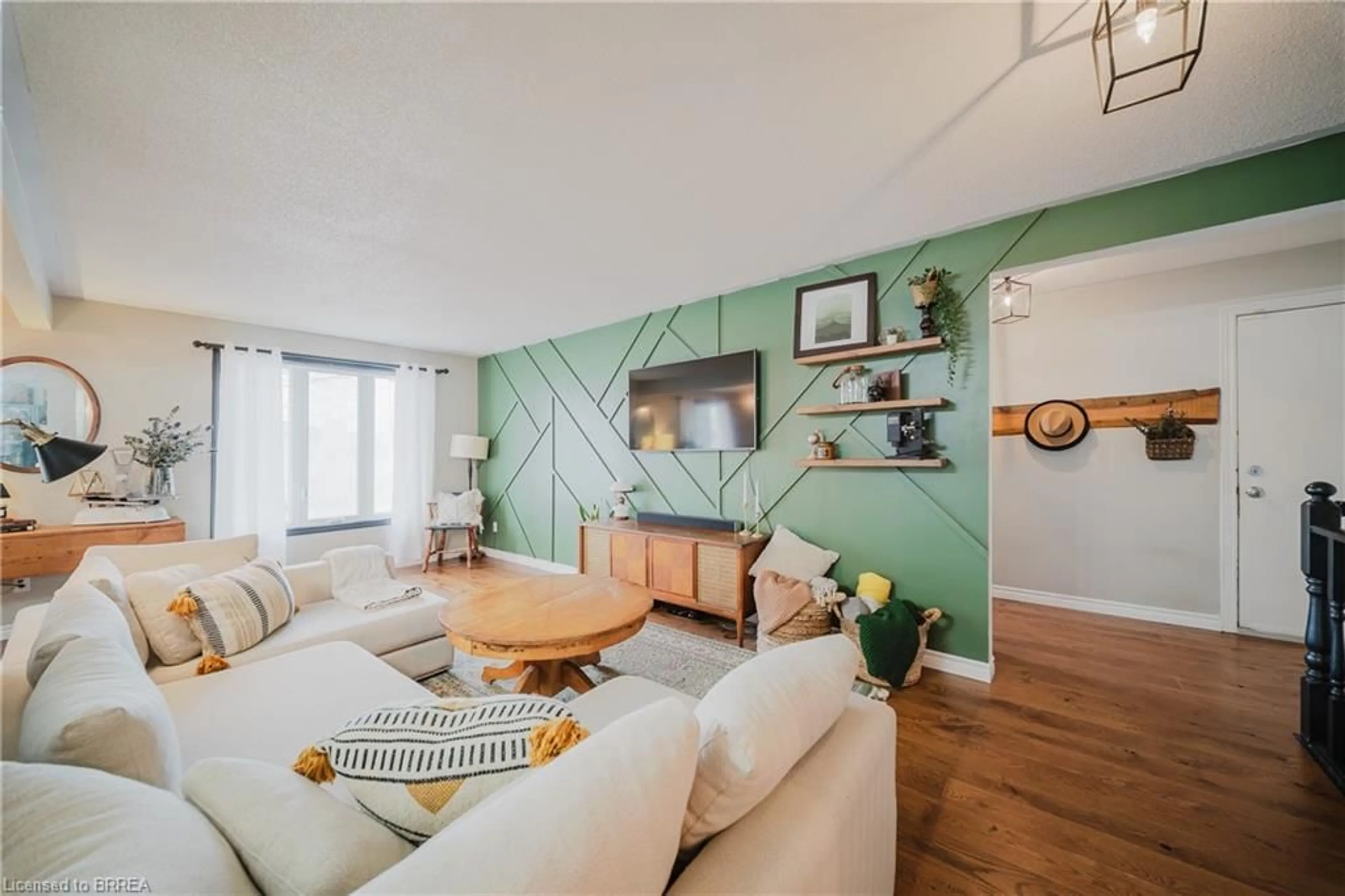 Living room with furniture, wood/laminate floor for 20 Windsor Dr, St. George Ontario N0E 1N0