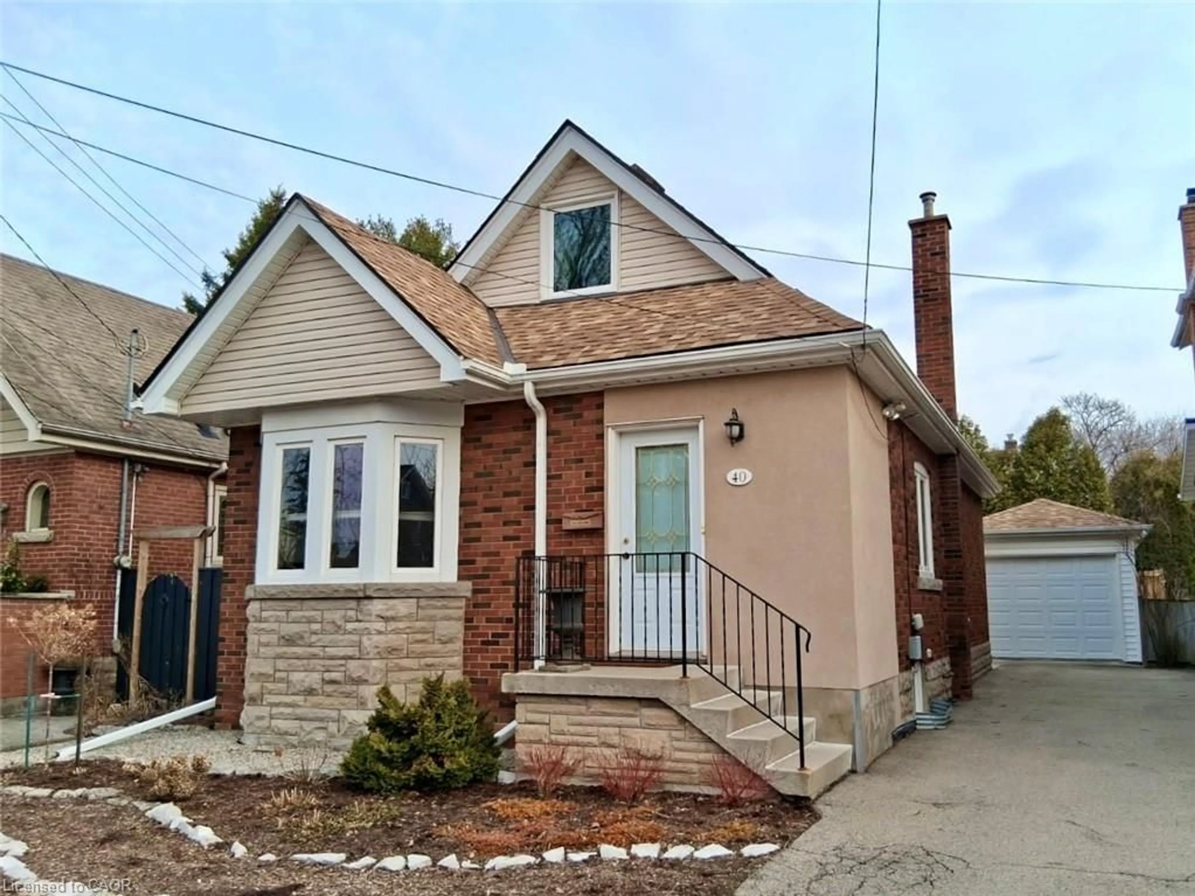 Home with brick exterior material, street for 40 Roanoke Rd, Hamilton Ontario L8S 3P7