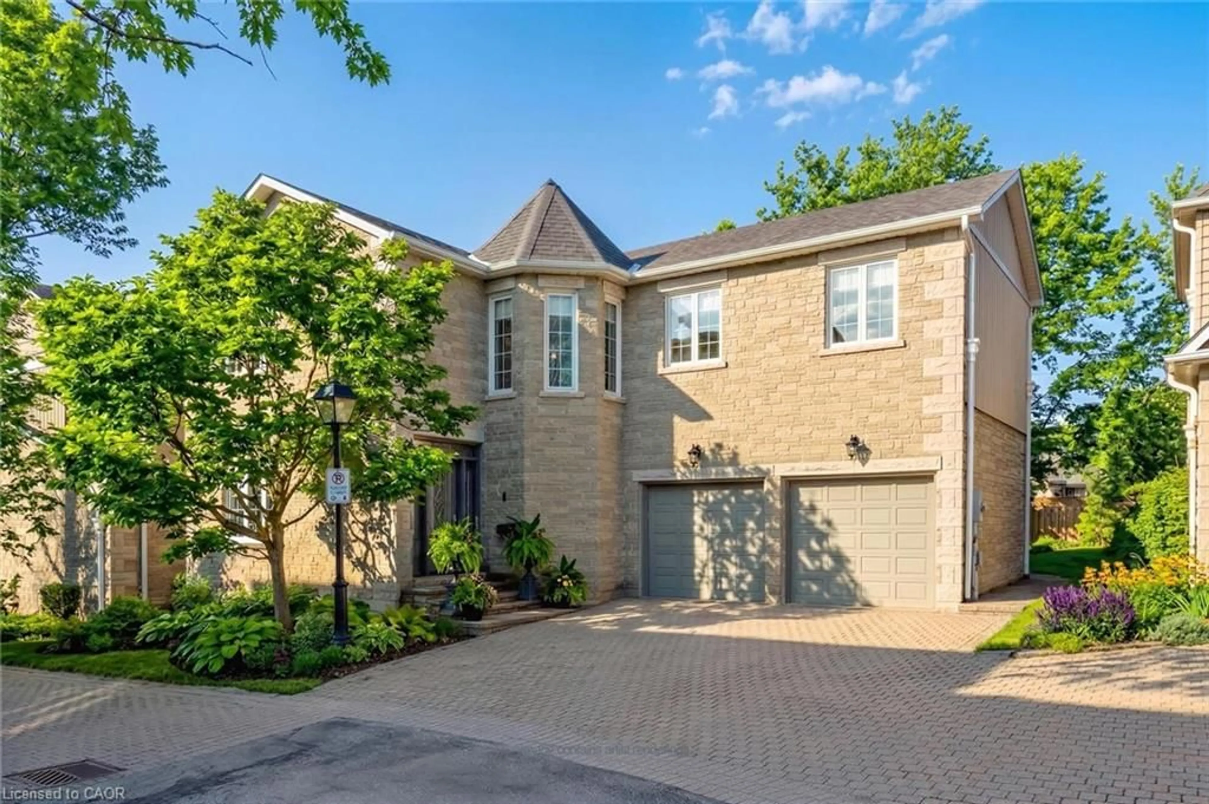 Home with brick exterior material, street for 25 Manor Park Cres #11, Guelph Ontario N1G 1A2