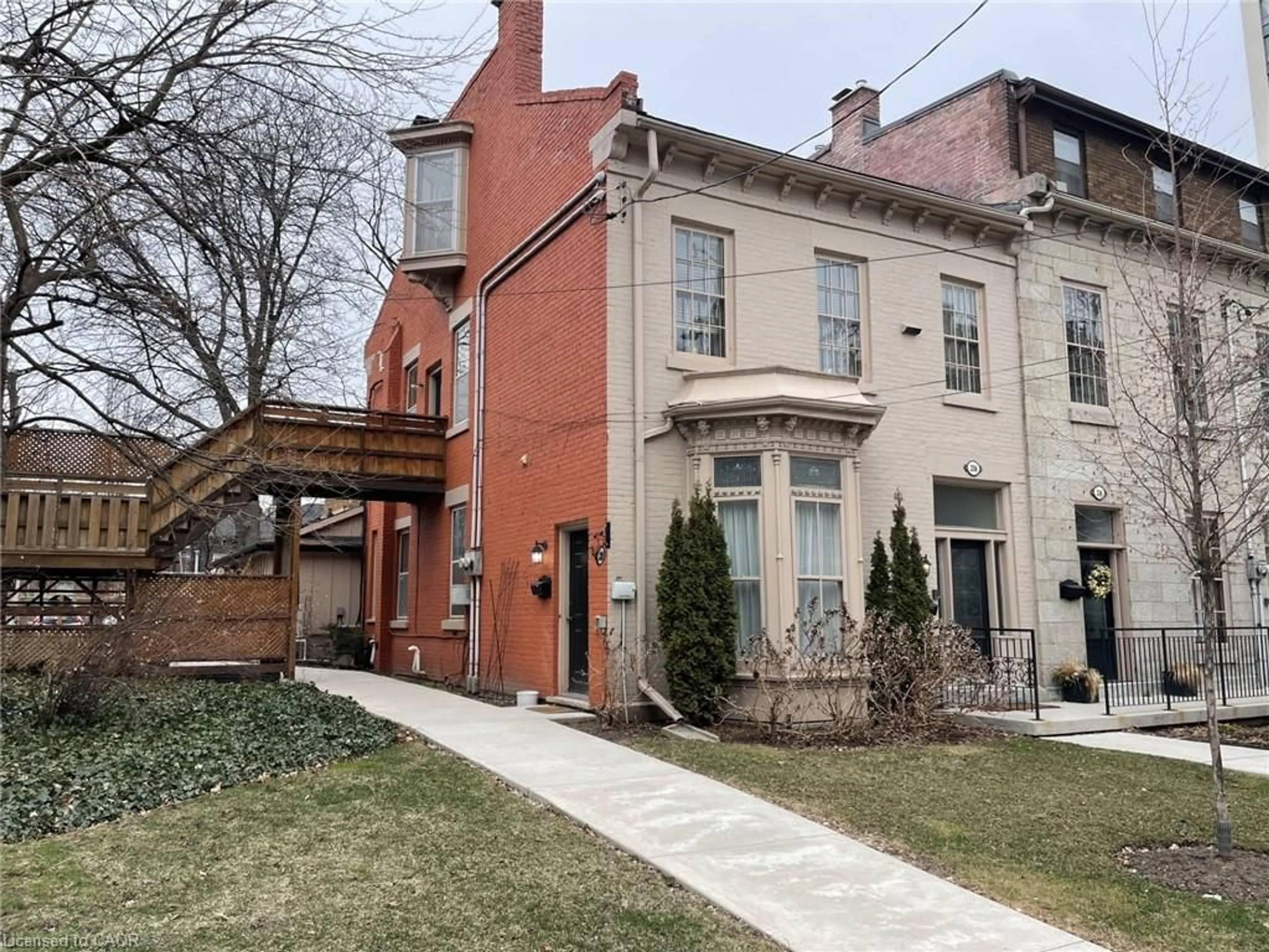 Home with brick exterior material, street for 218 Bay St, Hamilton Ontario L8P 3J1