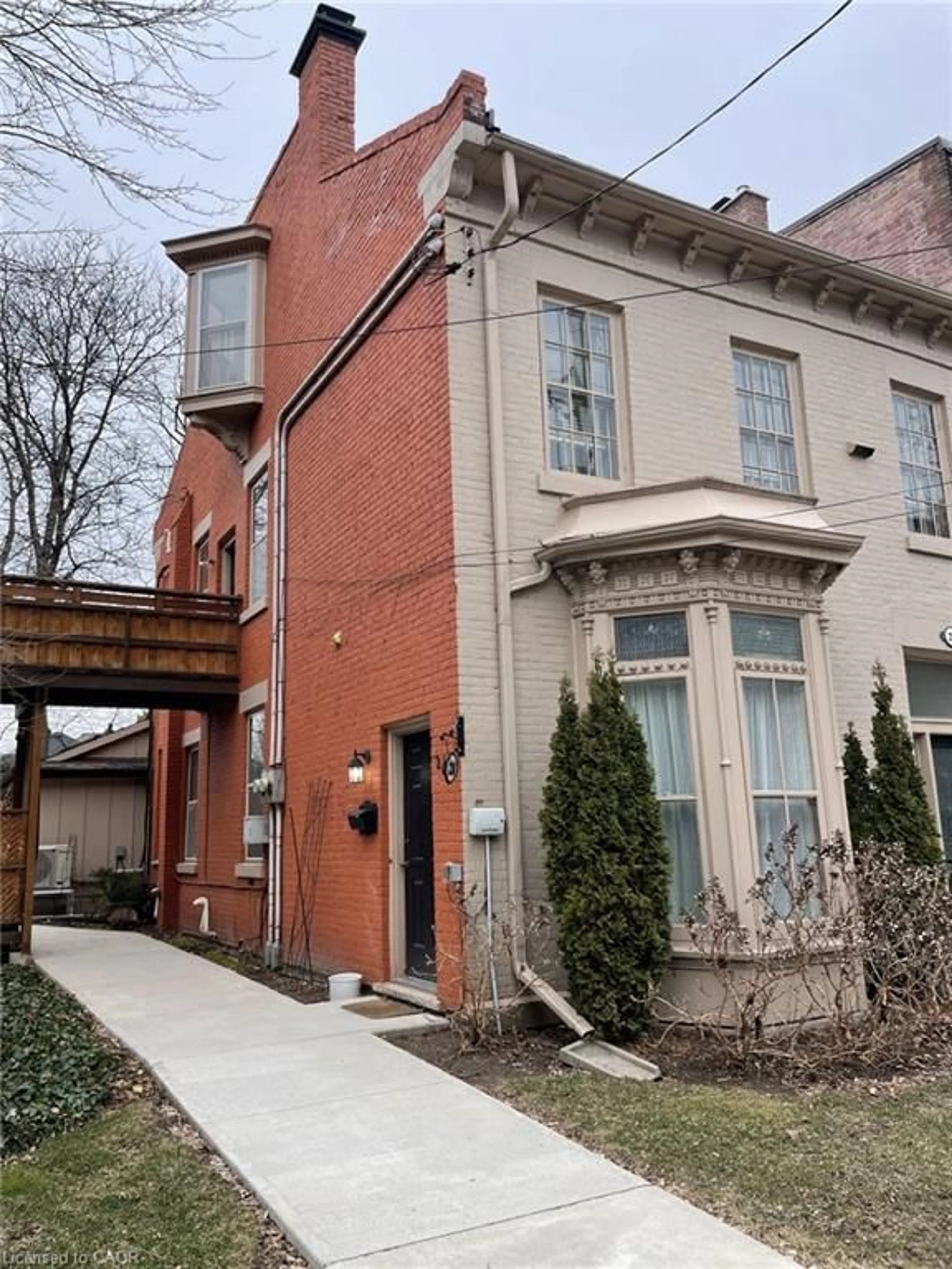 Home with brick exterior material, street for 218 Bay St, Hamilton Ontario L8P 3J1