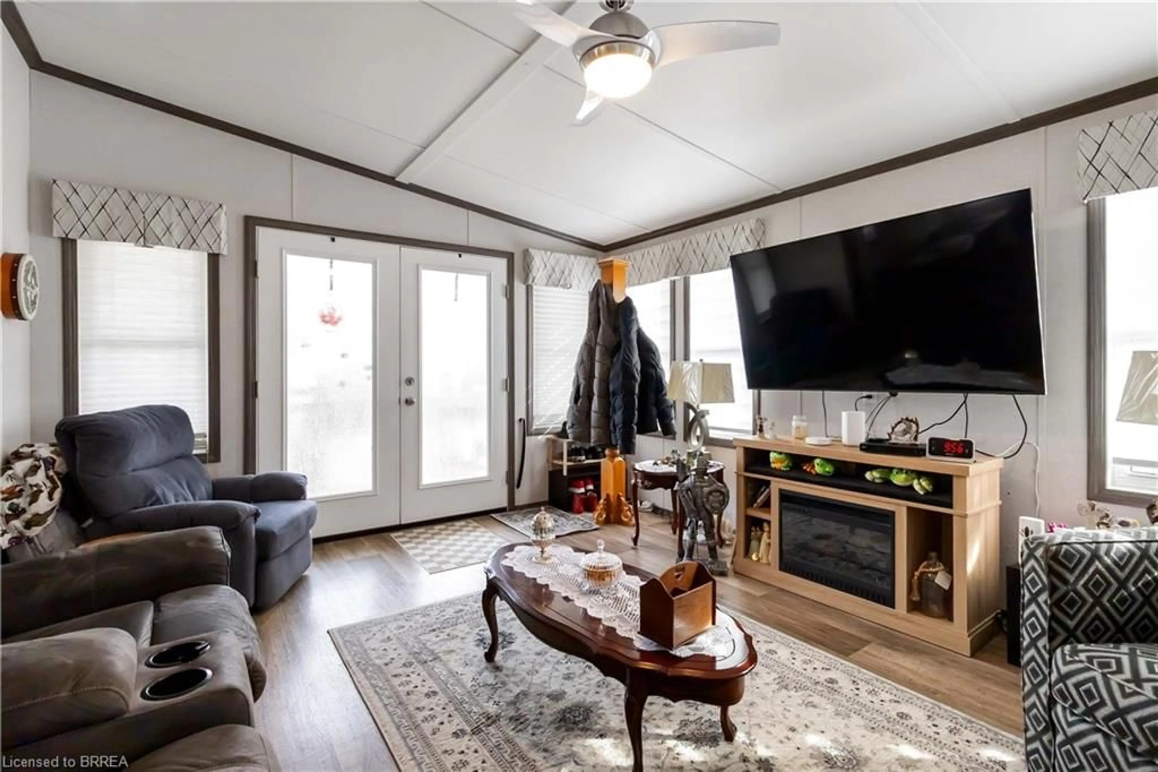 Living room with furniture, wood/laminate floor for 296 West Quarter Townline Rd #11, Harley Ontario N0E 1E0