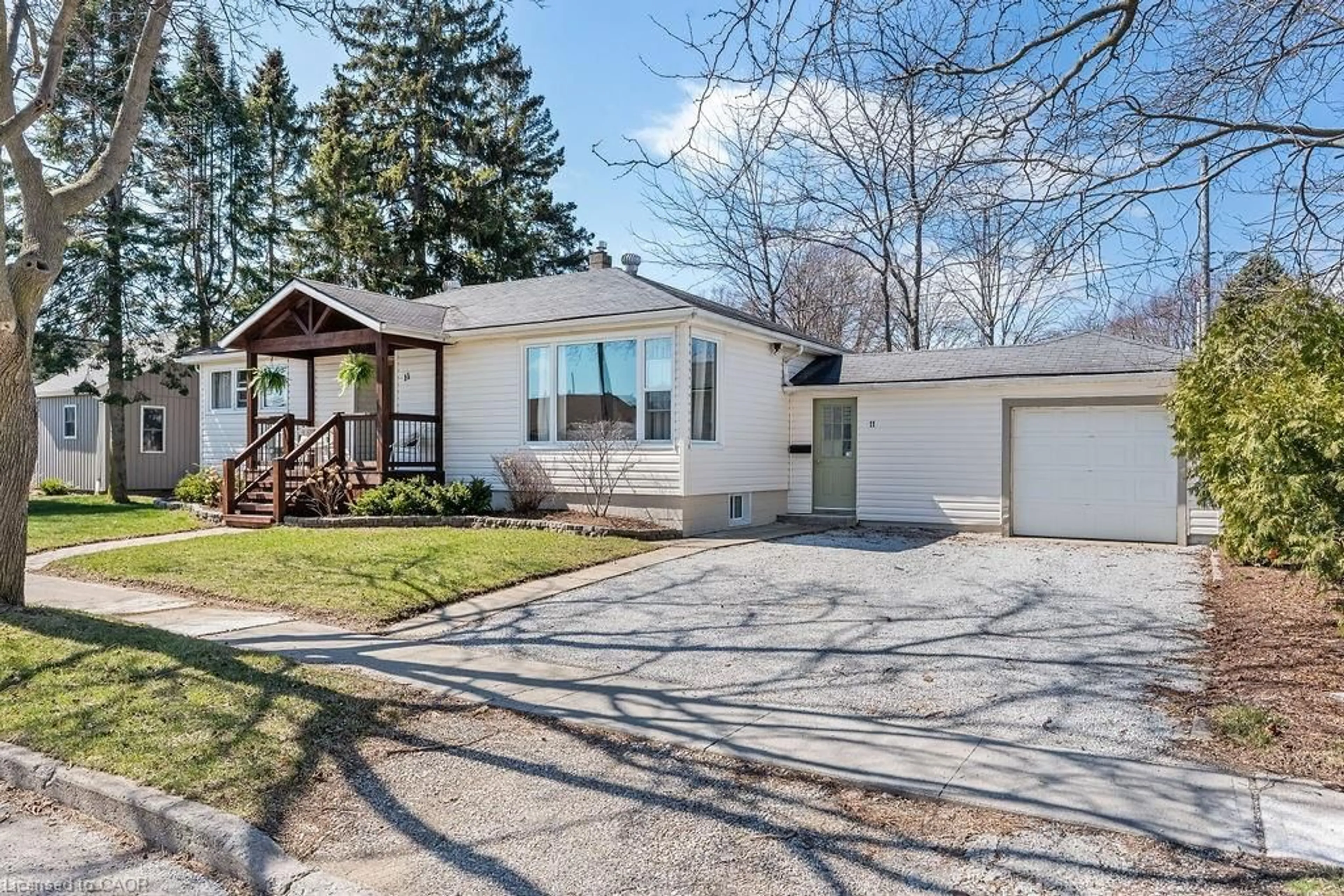 Home with vinyl exterior material, street for 11 Martin Dr, Leamington Ontario N8H 2R5