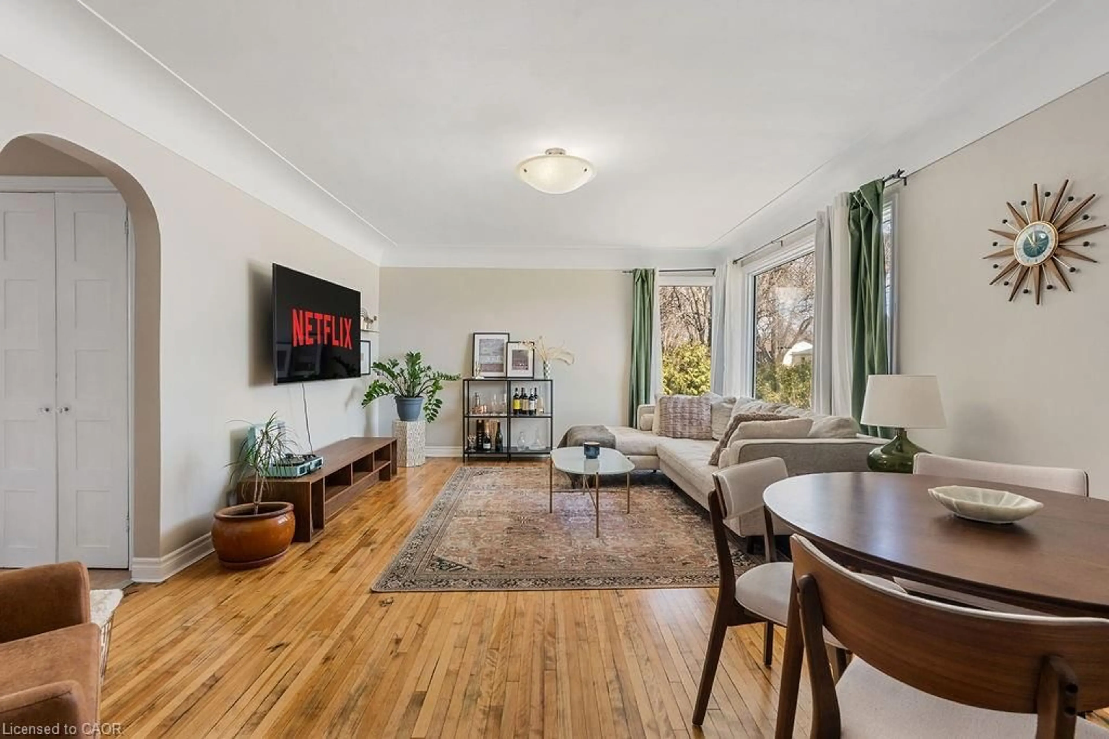 Living room with furniture, wood/laminate floor for 11 Martin Dr, Leamington Ontario N8H 2R5