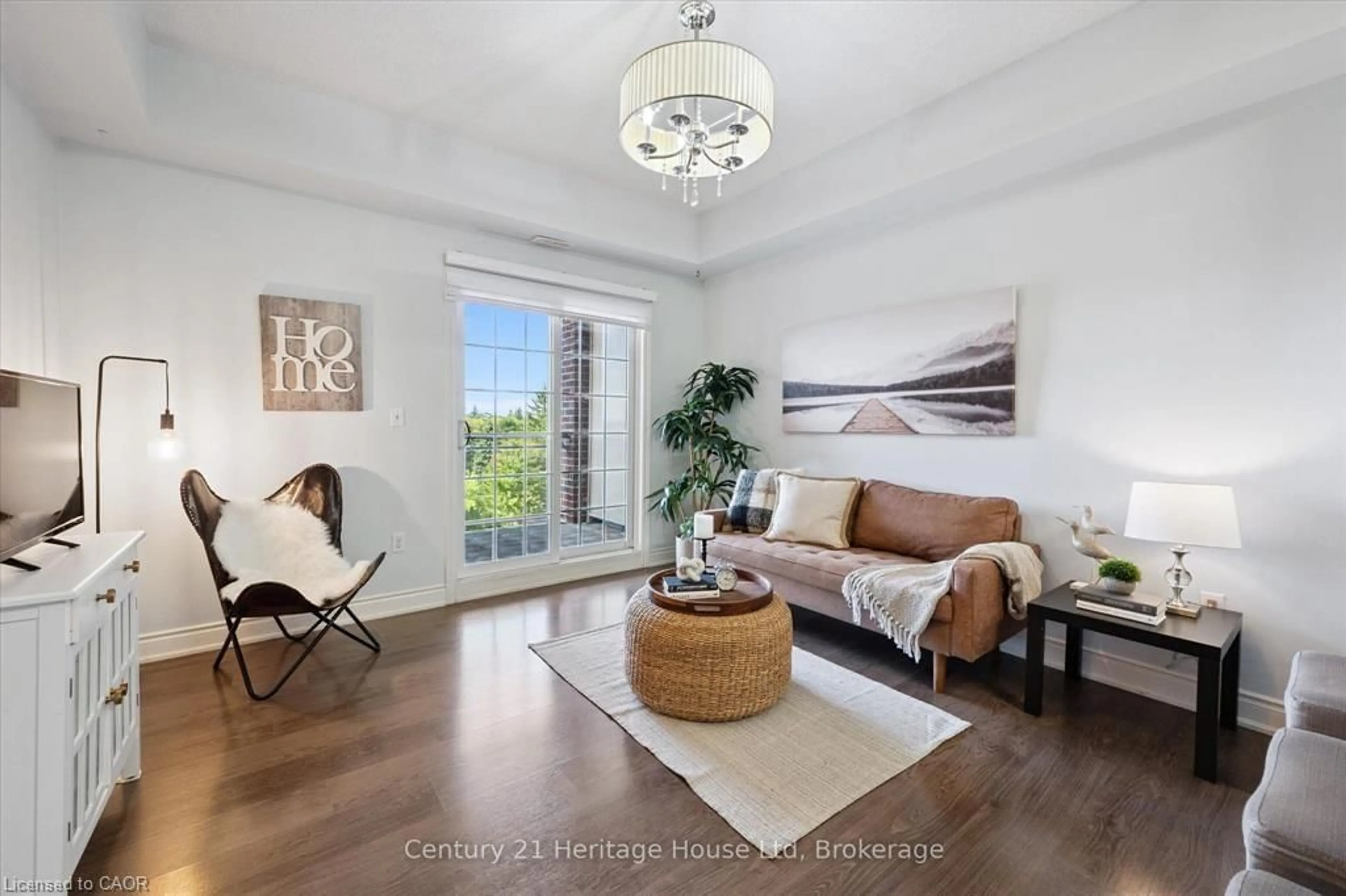 Living room with furniture, wood/laminate floor for 1440 Gordon St #404, Guelph Ontario N1L 1C8