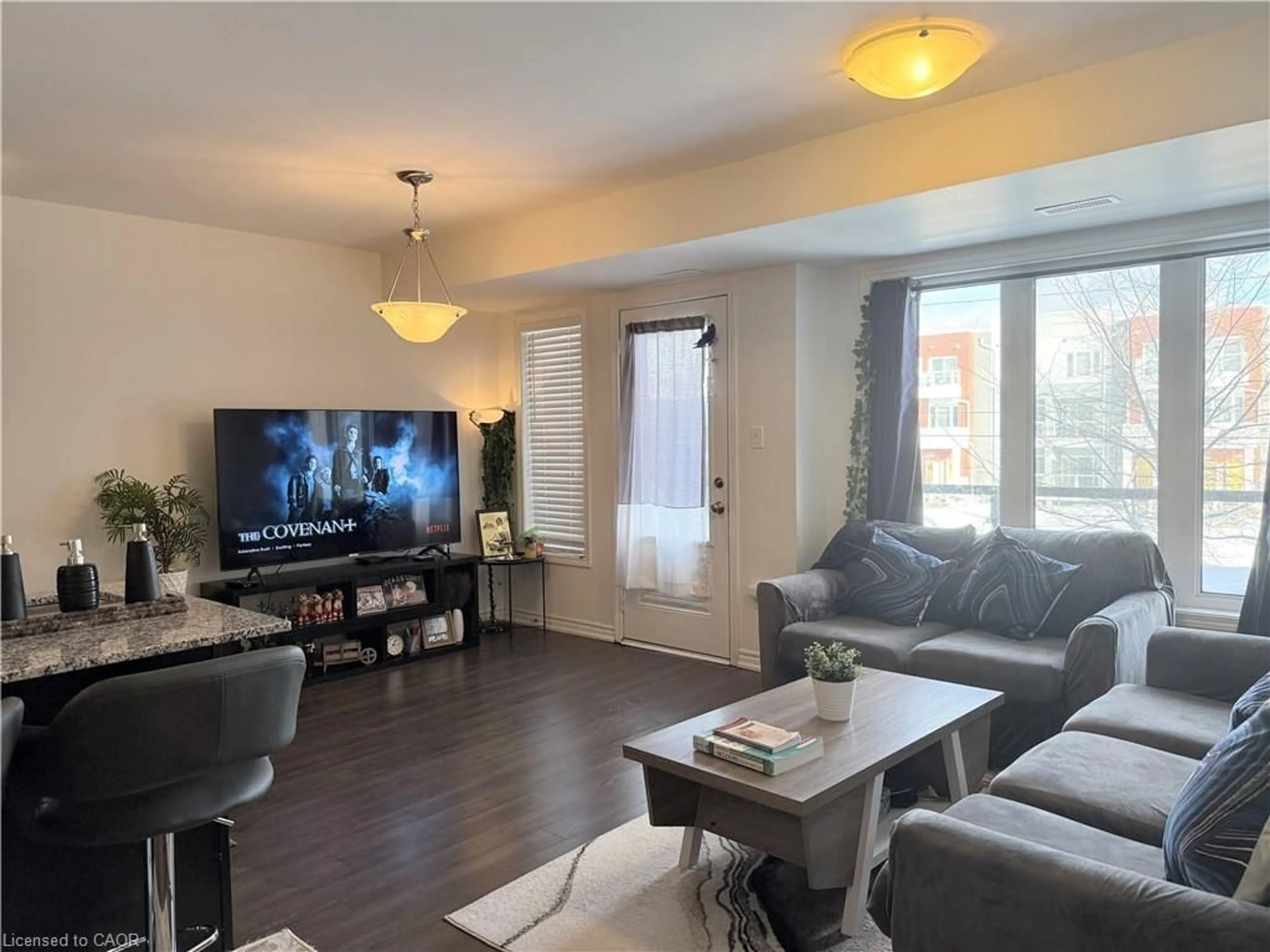 Living room with furniture, wood/laminate floor for 922 Apple Hill Lane, Kitchener Ontario N2R 0L7