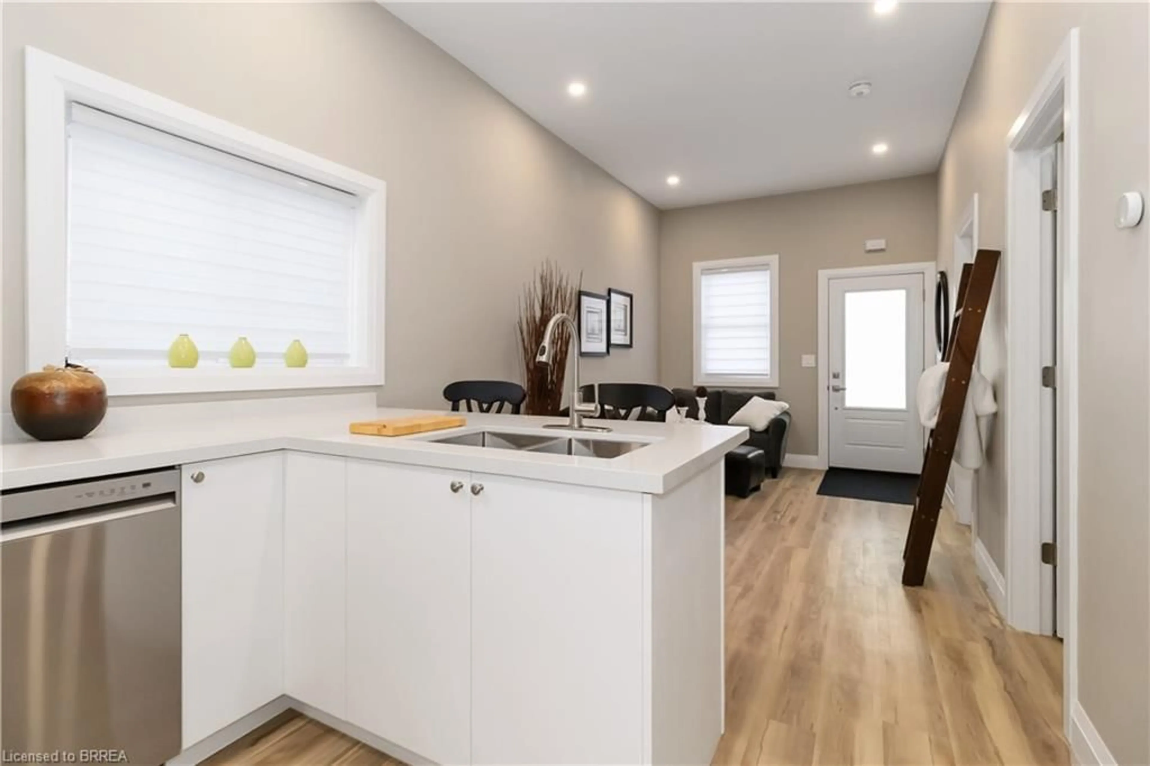 Open concept kitchen, wood/laminate floor for 16 Mt. Pleasant St, Brantford Ontario N3T 1S5