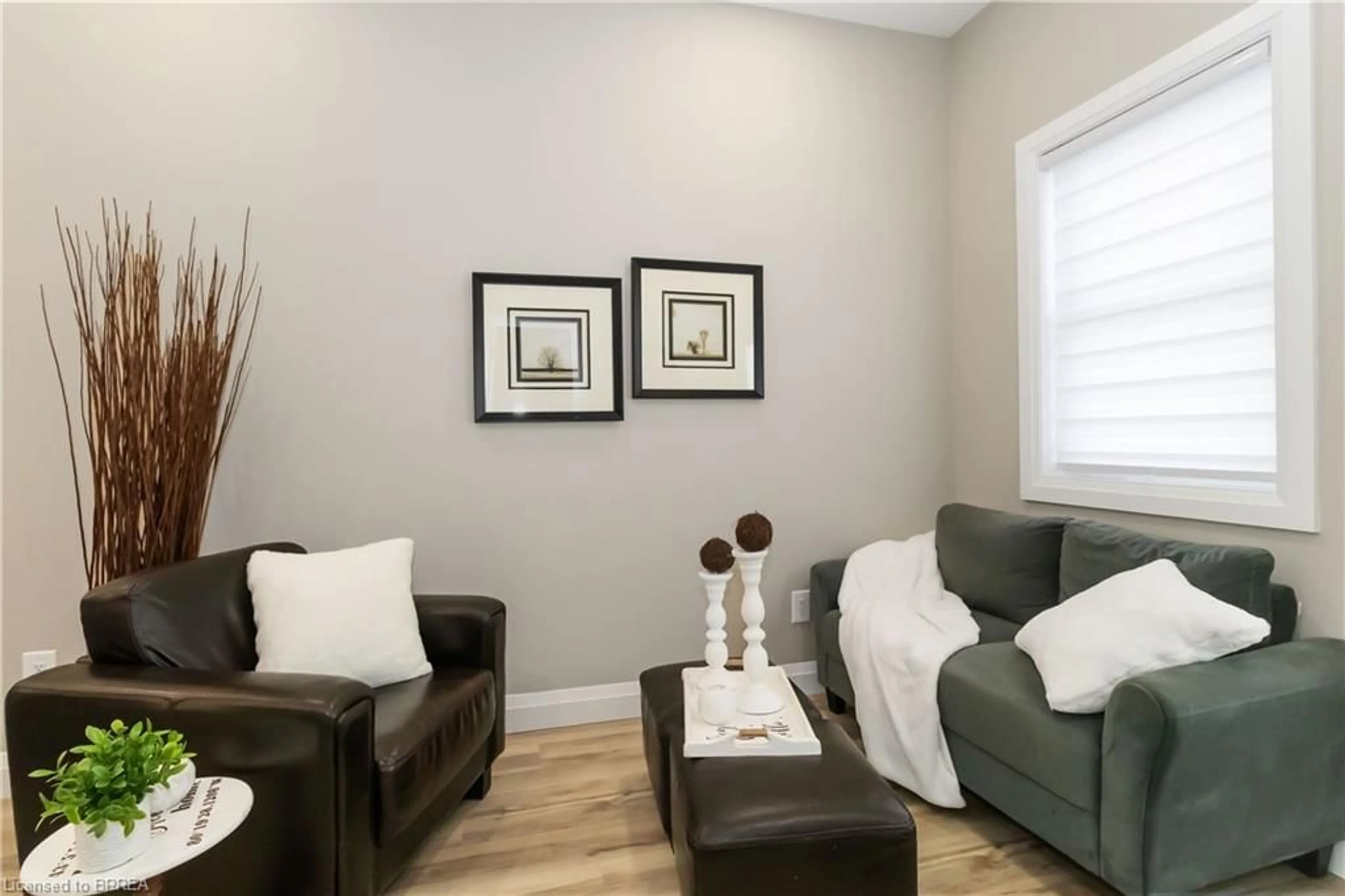 Living room with furniture, wood/laminate floor for 16 Mt. Pleasant St, Brantford Ontario N3T 1S5