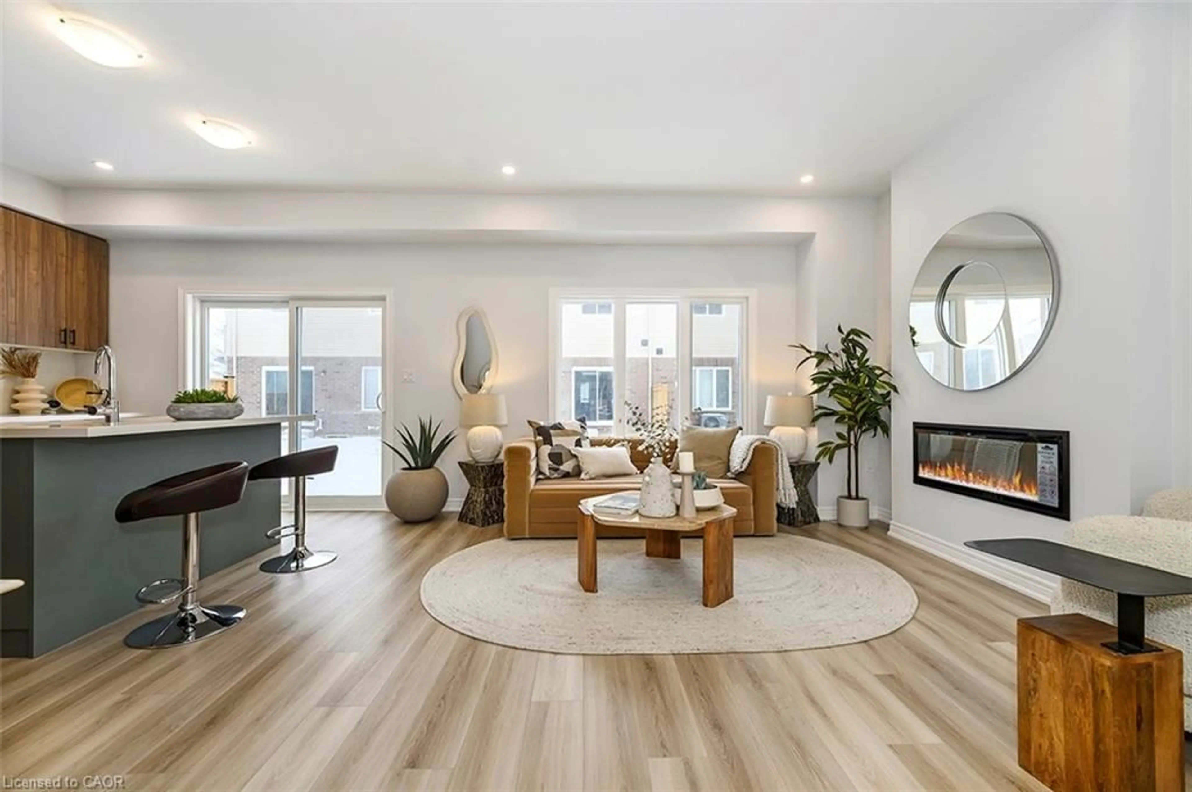 Living room with furniture, wood/laminate floor for 205 Thames Way #28, Hamilton Ontario L0R 1W2