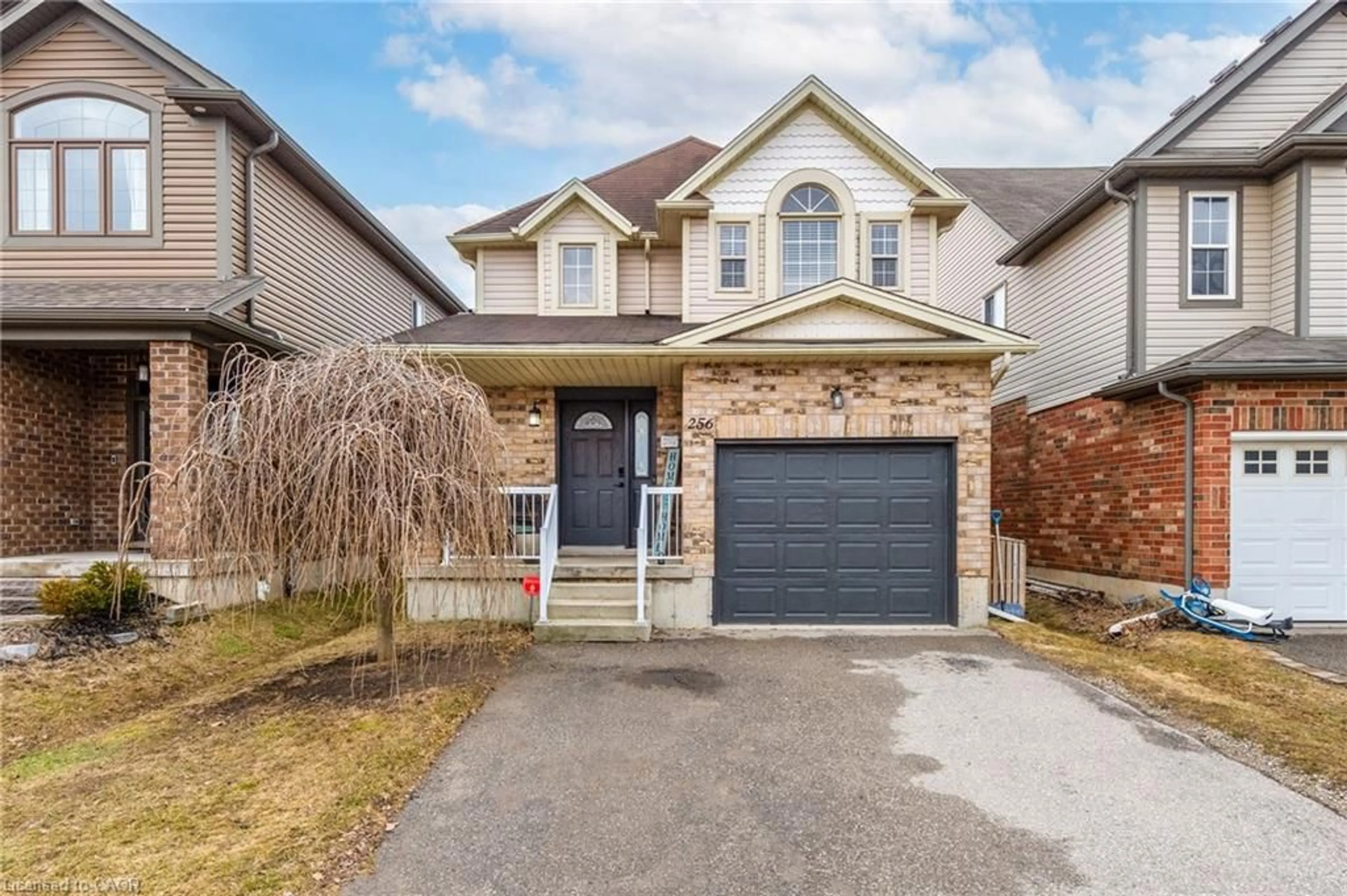 Home with brick exterior material, street for 256 Sienna Cres, Kitchener Ontario N2R 1T5