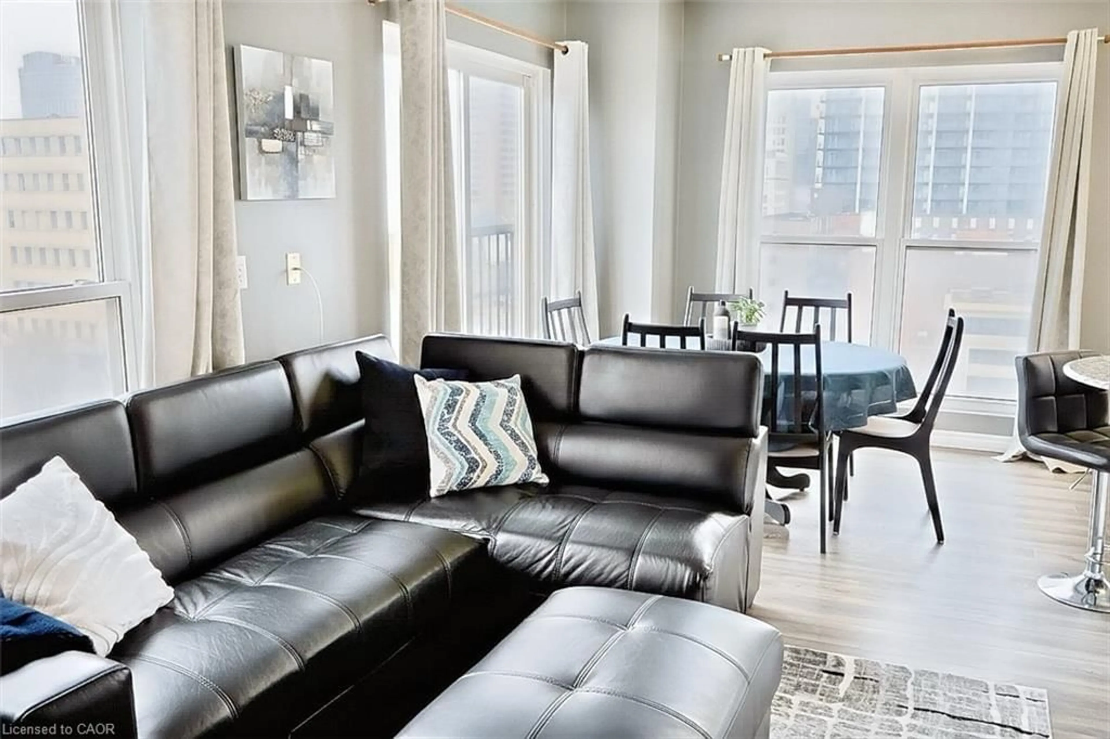 Living room with furniture, unknown for 135 James St #701, Hamilton Ontario L8P 2Z6