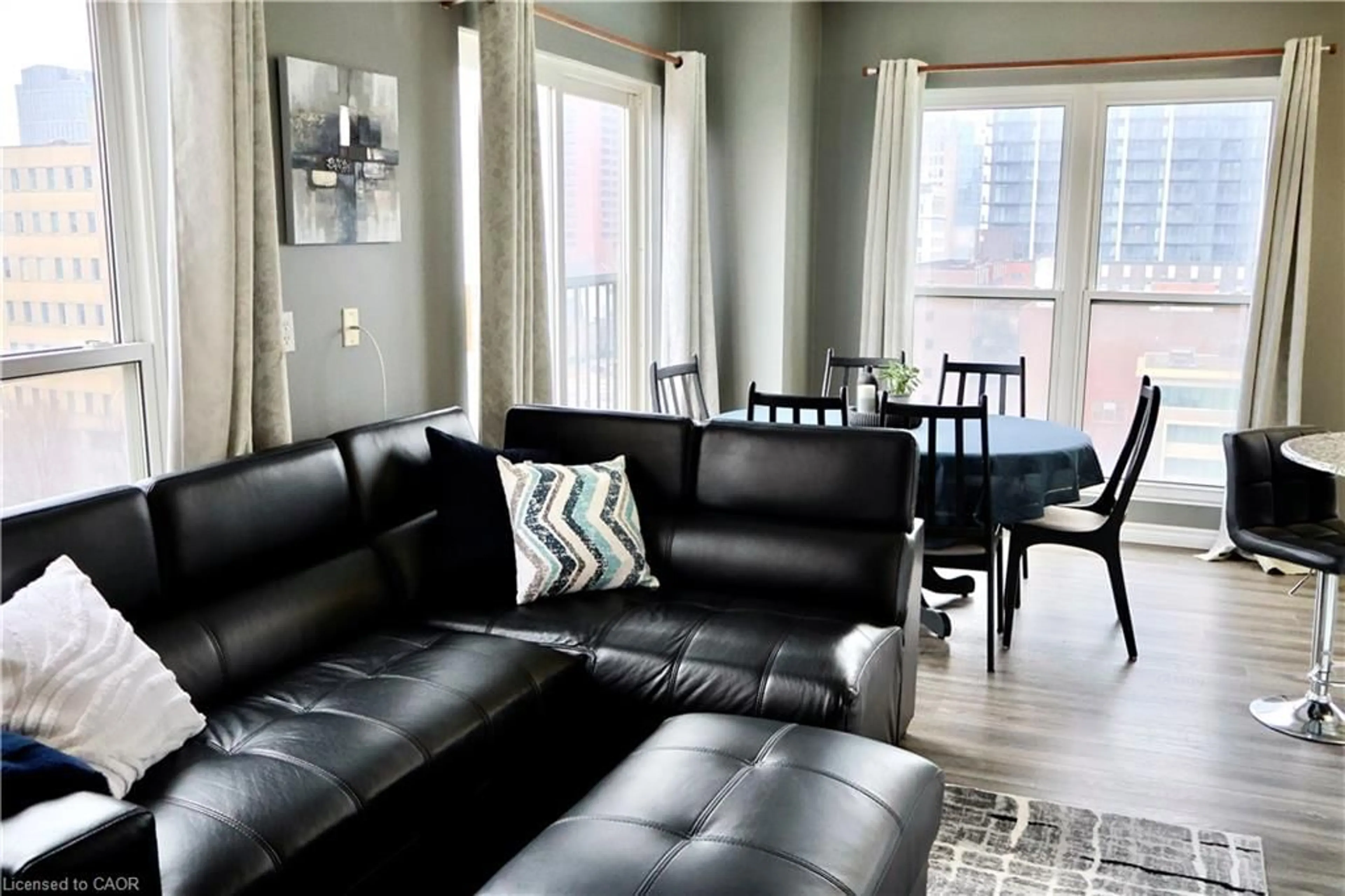 Living room with furniture, unknown for 135 James St #701, Hamilton Ontario L8P 2Z6