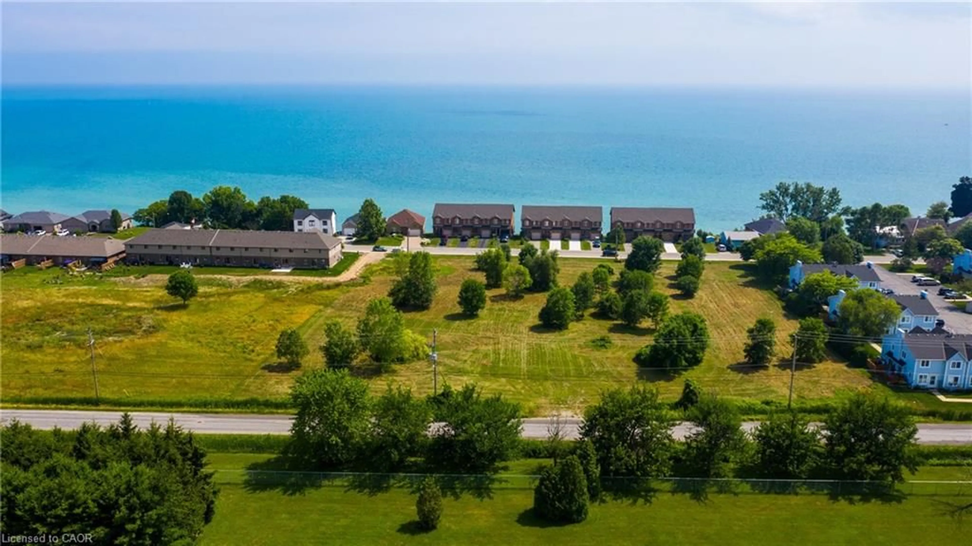 A pic from outside/outdoor area/front of a property/back of a property/a pic from drone, water/lake/river/ocean view for 38 New Lakeshore Rd, Port Dover Ontario N0A 1N3