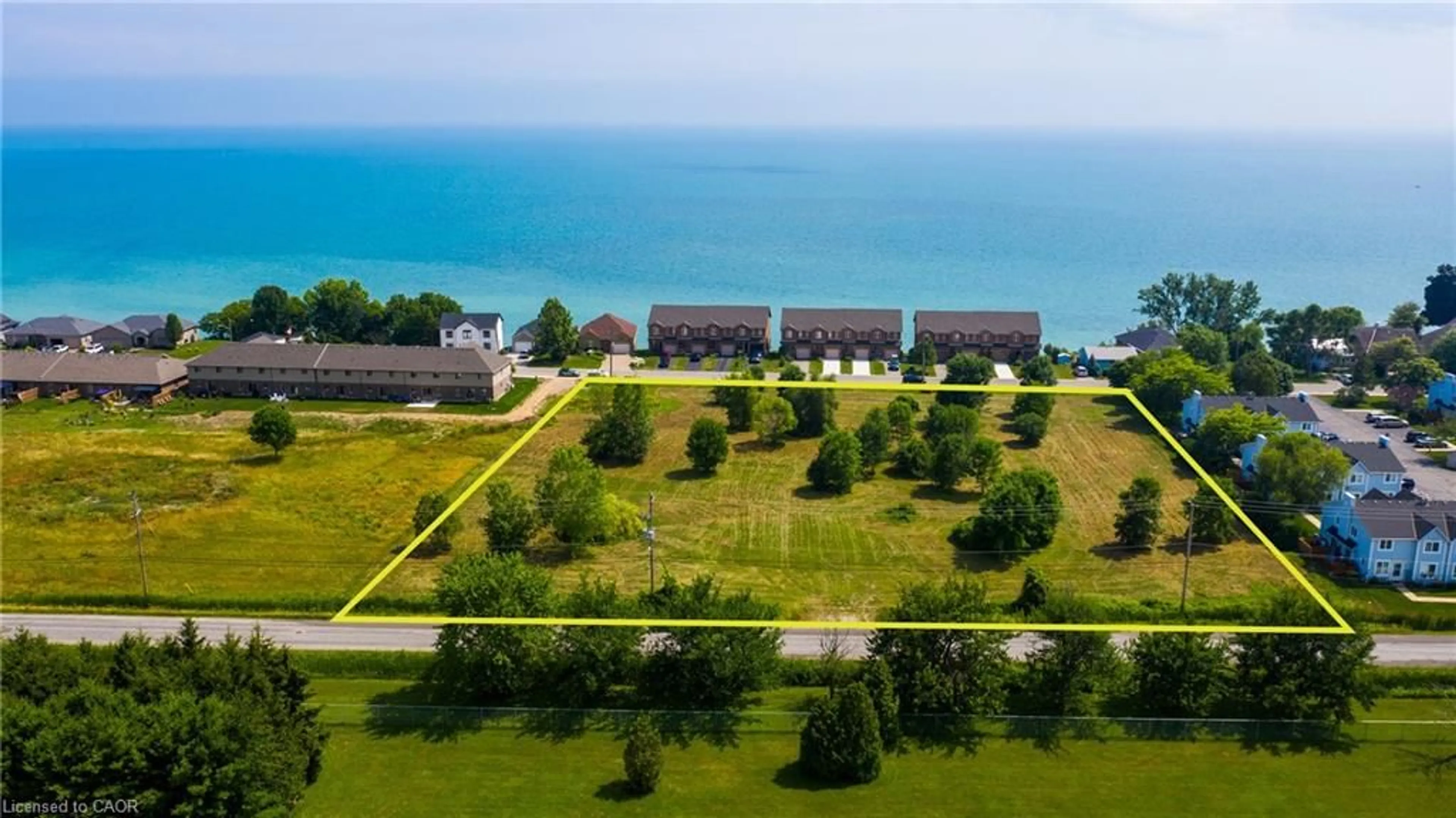 A pic from outside/outdoor area/front of a property/back of a property/a pic from drone, water/lake/river/ocean view for 38 New Lakeshore Rd, Port Dover Ontario N0A 1N3