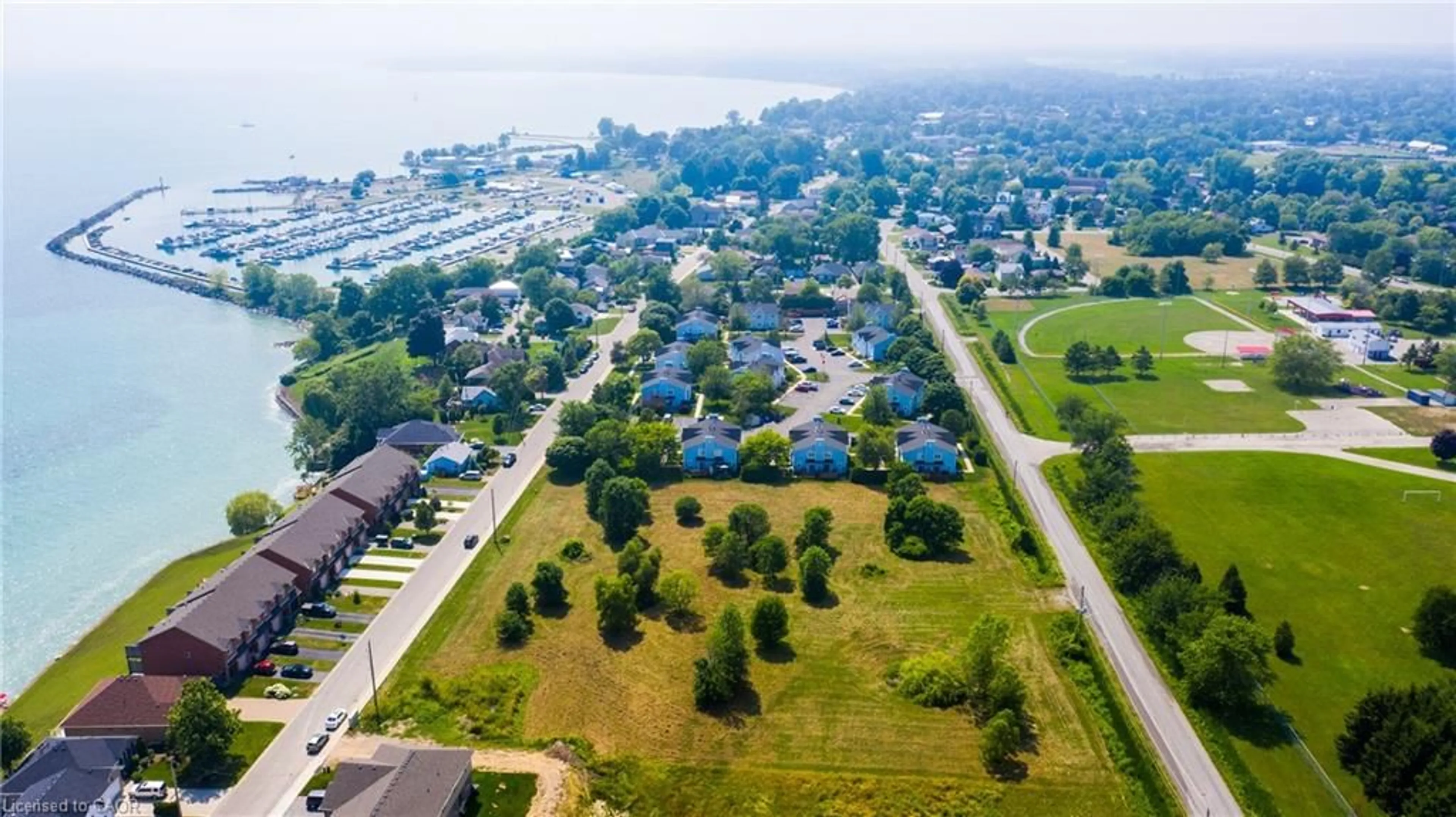 A pic from outside/outdoor area/front of a property/back of a property/a pic from drone, water/lake/river/ocean view for 38 New Lakeshore Rd, Port Dover Ontario N0A 1N3