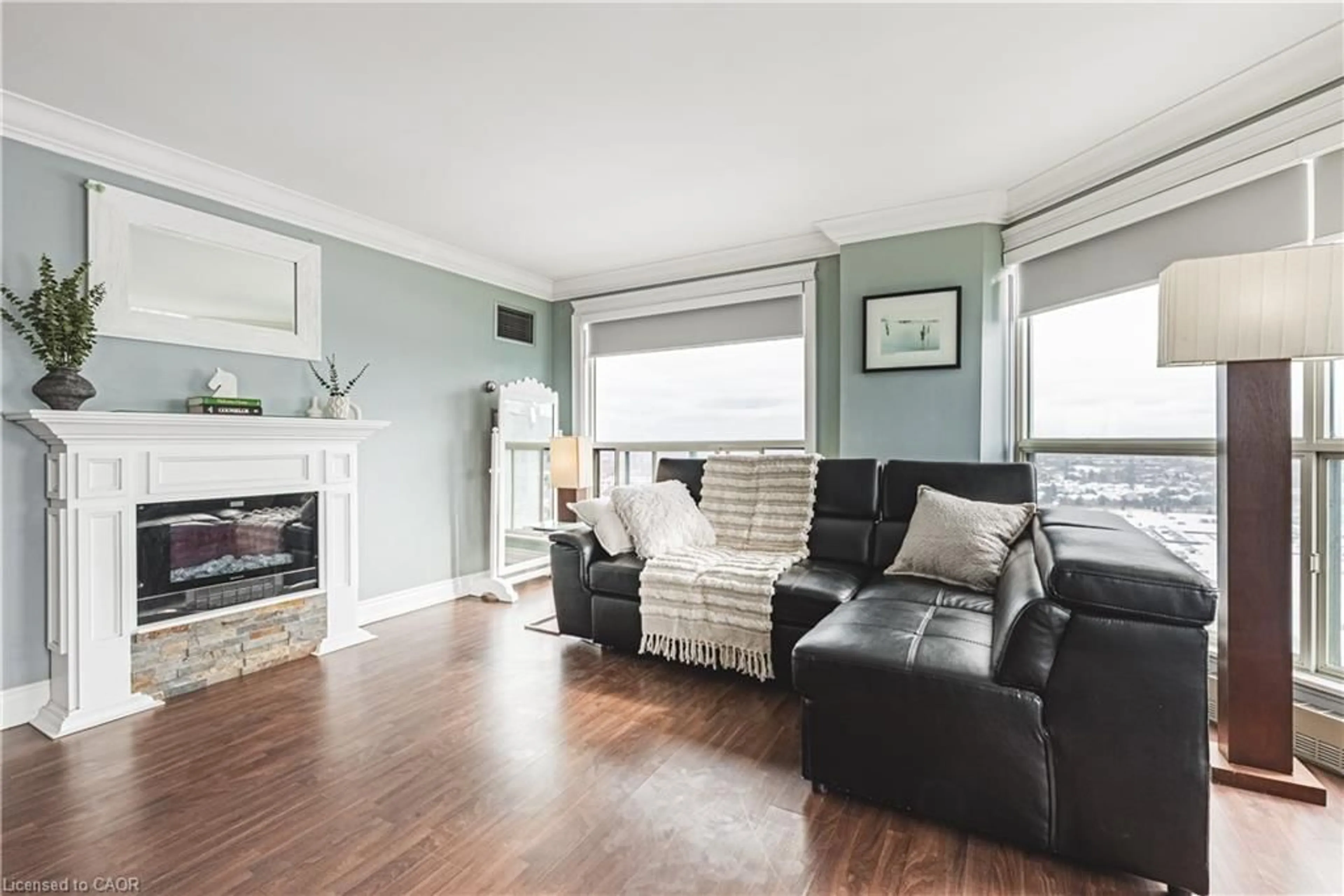 Living room with furniture, wood/laminate floor for 2155 Burnhamthorpe Rd #PH1904, Mississauga Ontario L5L 5P4