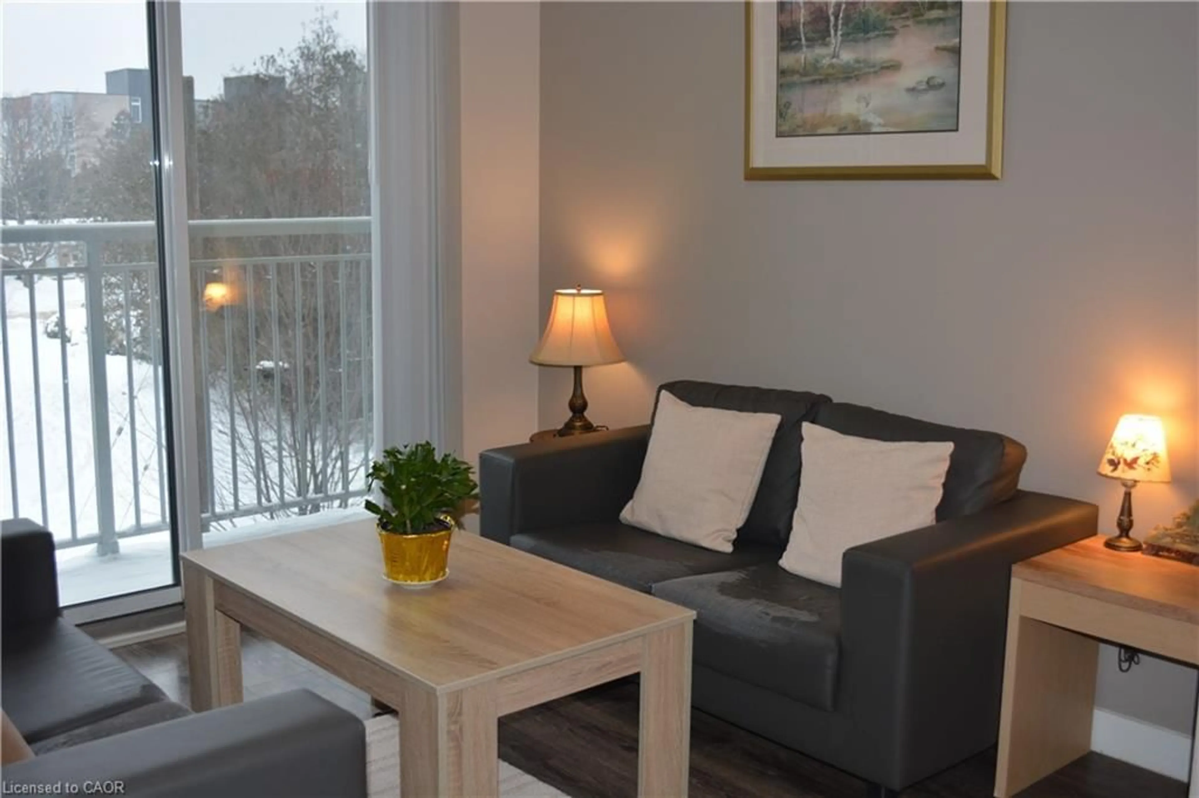 Living room with furniture, wood/laminate floor for 280 Lester St #323, Waterloo Ontario N2L 0G2
